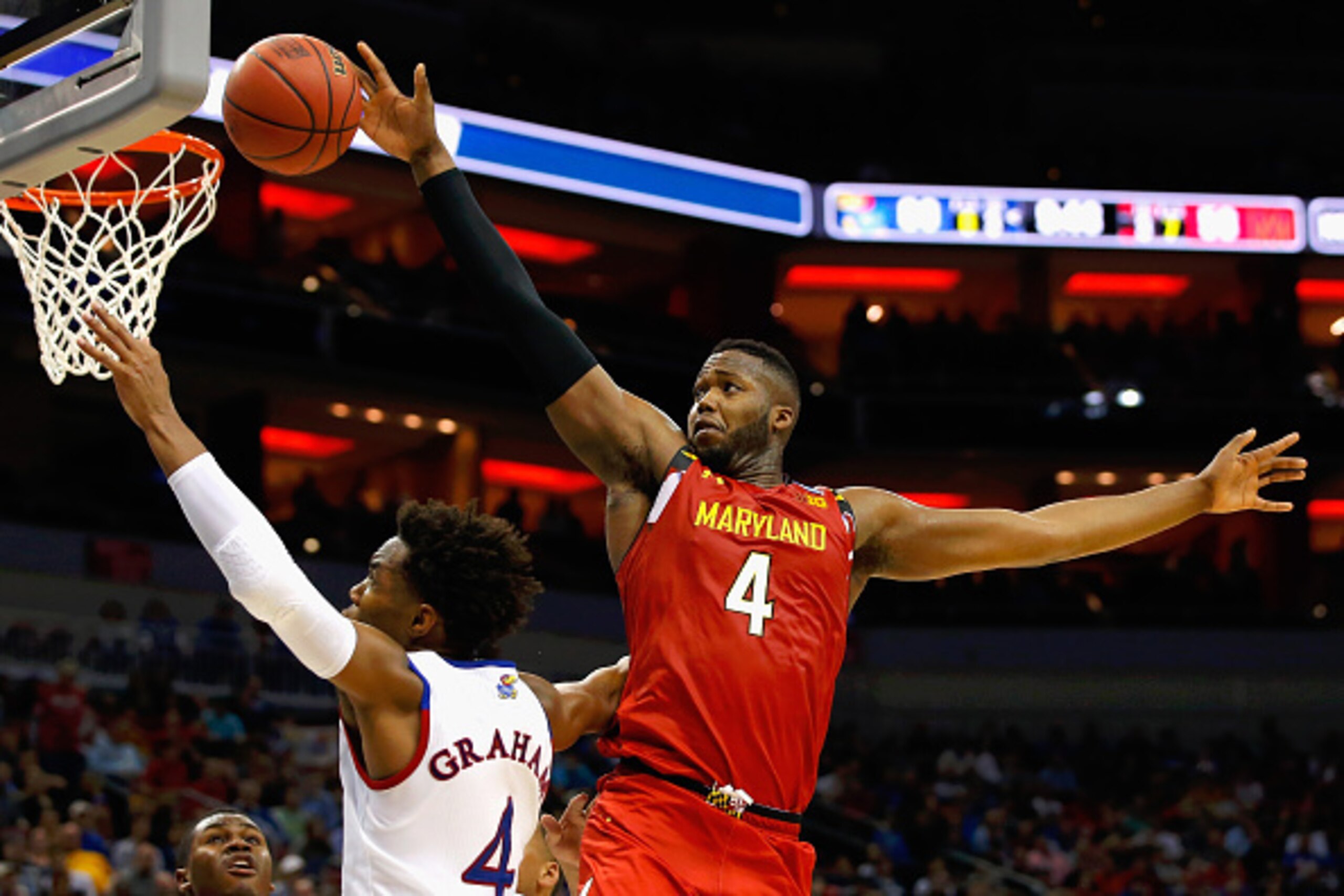 LOUISVILLE, KY - MARCH 24:  Robert Carter #4 of the Maryland Terrapins defends a shot by Devonte' Graham #4 of the Kansas Jayhawks in the second half during the 2016 NCAA Men's Basketball Tournament South Regional at KFC YUM! Center on March 24, 2016 in L