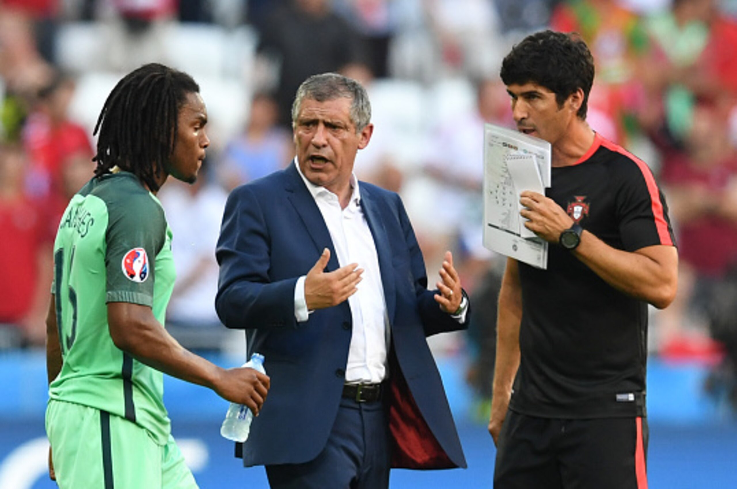Portugal's coach Fernando Santos (C) reacts at the end of the Euro 2016 group F football match between Hungary and Portugal at the Parc Olympique Lyonnais stadium in Decines-Charpieu, near Lyon, on June 22, 2016. / AFP / FRANCISCO LEONG        (Photo cred