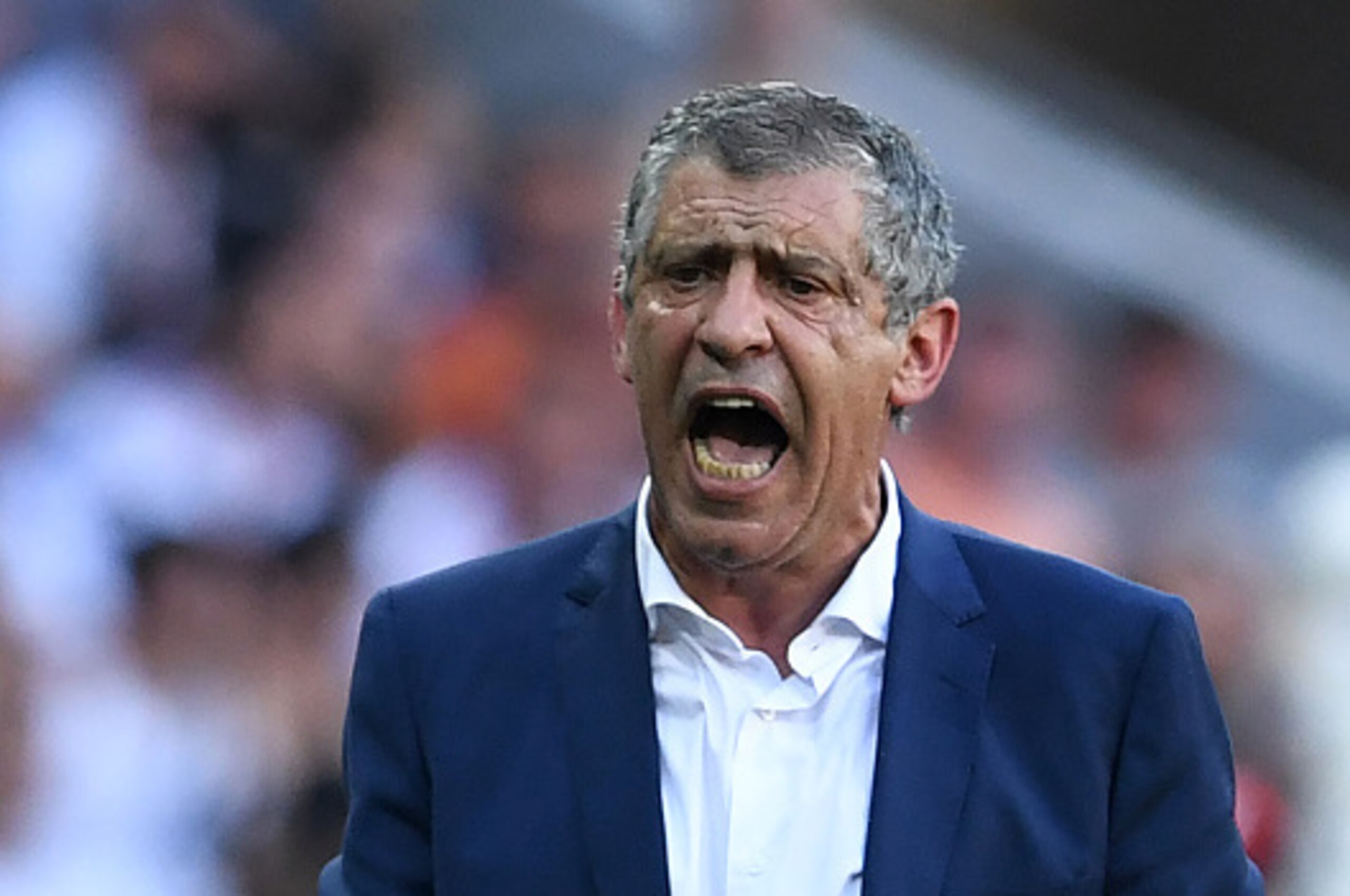 Portugal's coach Fernando Santos reacts during the Euro 2016 group F football match between Hungary and Portugal at the Parc Olympique Lyonnais stadium in Decines-Charpieu, near Lyon, on June 22, 2016. / AFP / FRANCISCO LEONG        (Photo credit should r