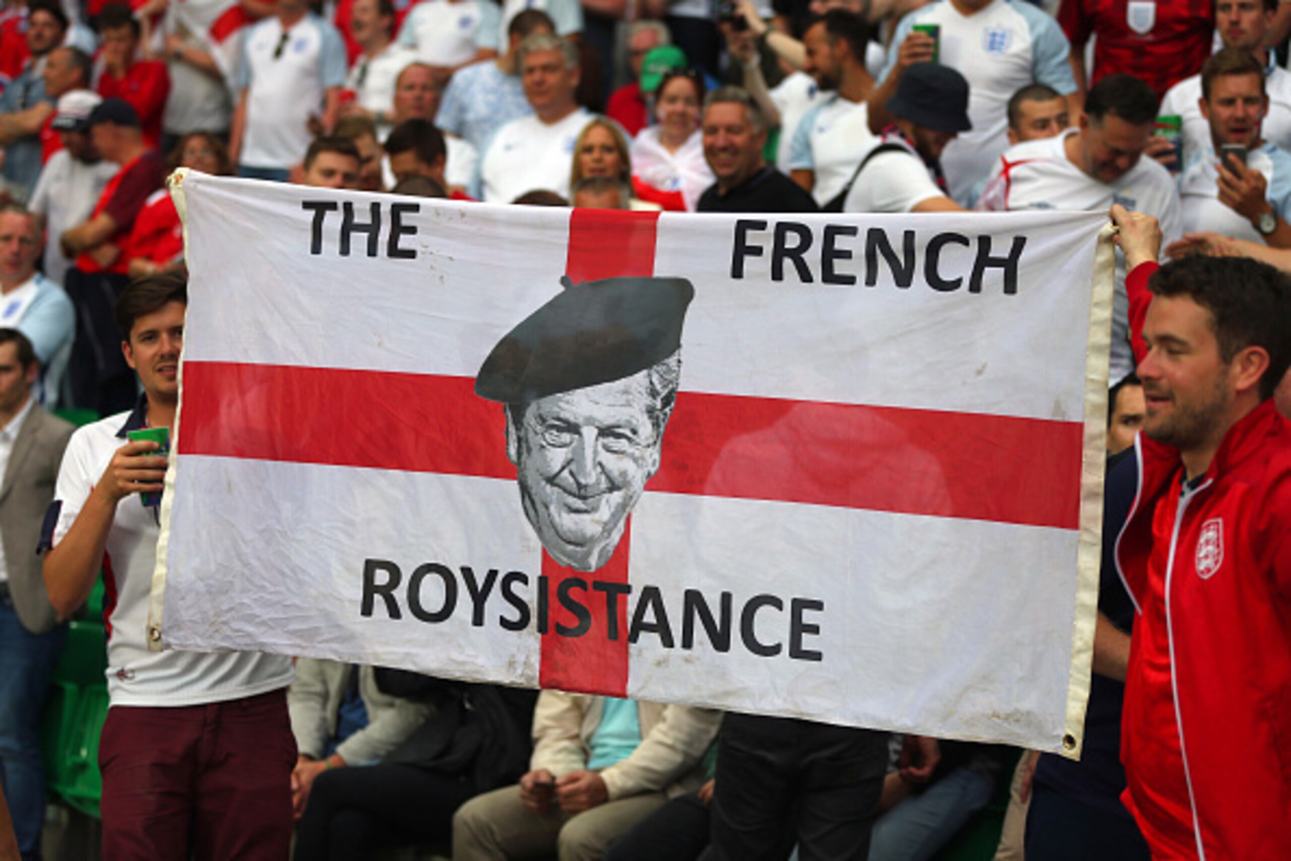 SAINT-ETIENNE, FRANCE - JUNE 20: England fans hold up a flag with a picture of Roy Hodgson manager of England saying The French Roysistance during the UEFA EURO 2016 Group B match between Slovakia v England at Stade Geoffroy-Guichard on June 20, 2016 in S