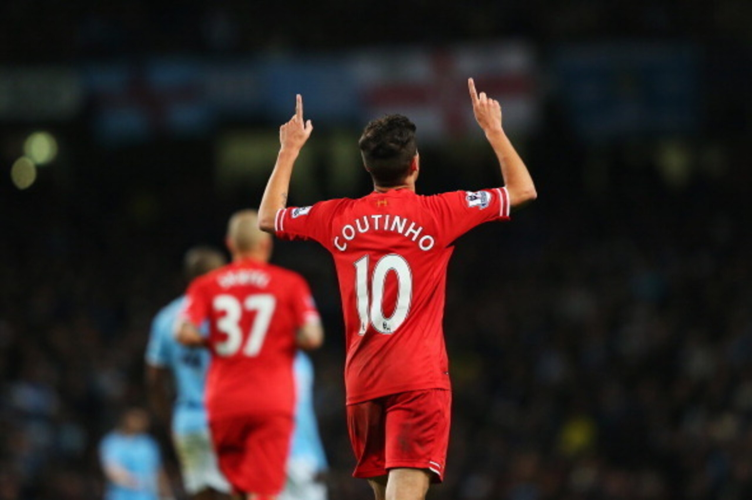 MANCHESTER, ENGLAND - DECEMBER 26: Philippe Coutinho of Liverpool celebrates the opening goal during the Barclays Premier League match between Manchester City and Liverpool at Etihad Stadium on December 26, 2013 in Manchester, England.  (Photo by Alex Liv