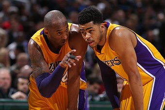 MILWAUKEE, WI - FEBRUARY 22:  Kobe Bryant #24 and D'Angelo Russell #1 of the Los Angeles Lakers talk during the game against the Milwaukee Bucks on February 22, 2016 at the BMO Harris Bradley Center in Milwaukee, Wisconsin. NOTE TO USER: User expressly ac