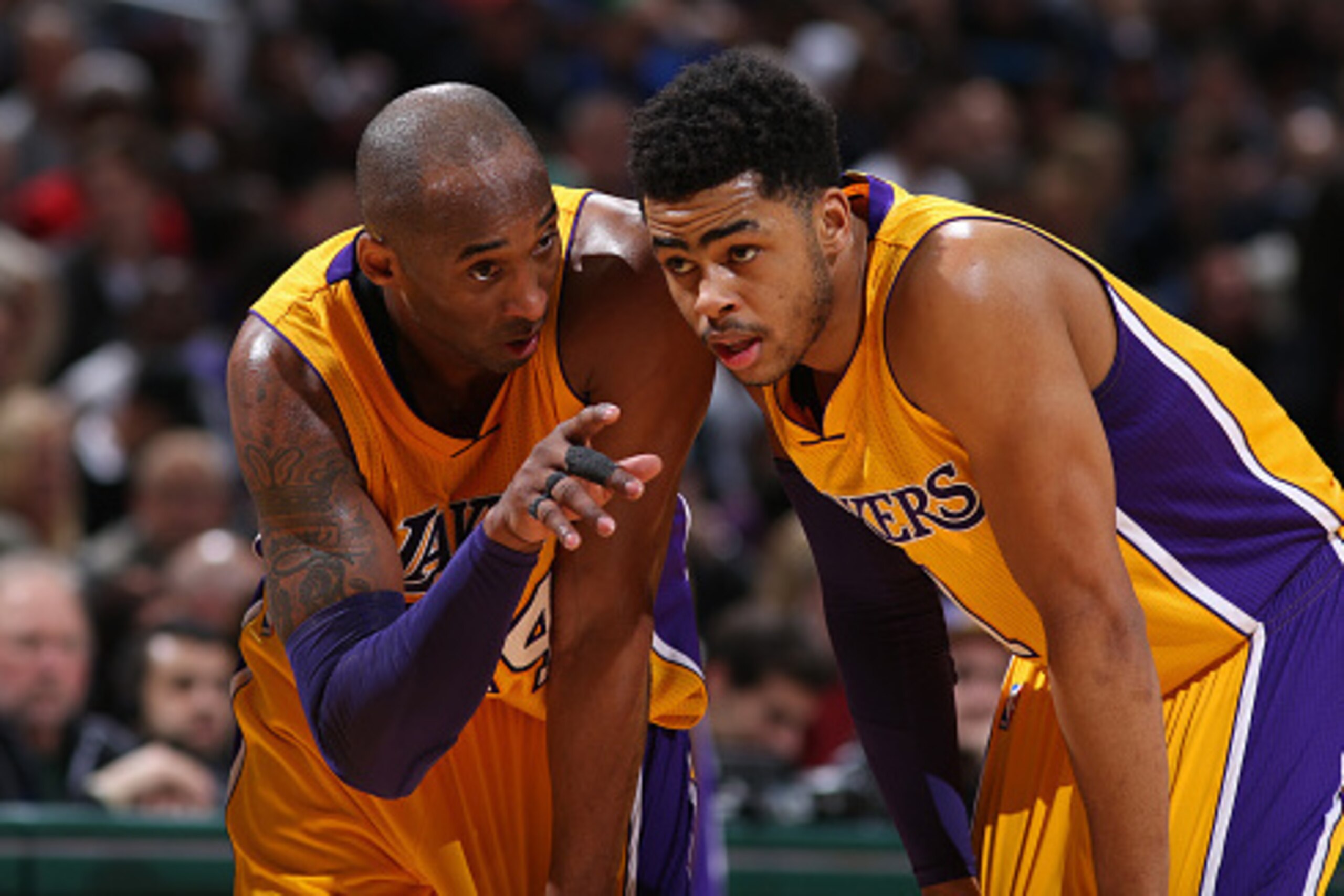 MILWAUKEE, WI - FEBRUARY 22:  Kobe Bryant #24 and D'Angelo Russell #1 of the Los Angeles Lakers talk during the game against the Milwaukee Bucks on February 22, 2016 at the BMO Harris Bradley Center in Milwaukee, Wisconsin. NOTE TO USER: User expressly ac