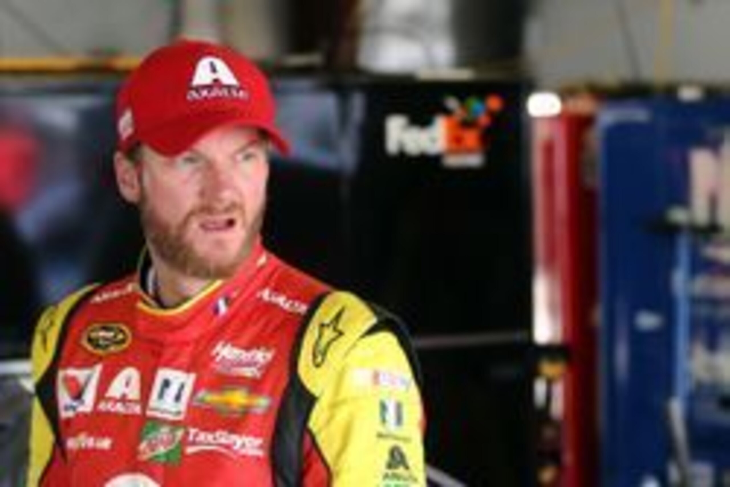 Jun 12, 2016; Brooklyn, MI, USA; Sprint Cup Series driver Dale Earnhardt Jr. stands in the garage after wrecking his car during the FireKeepers Casino 400 at Michigan International Speedway. Mandatory Credit: Aaron Doster-USA TODAY Sports