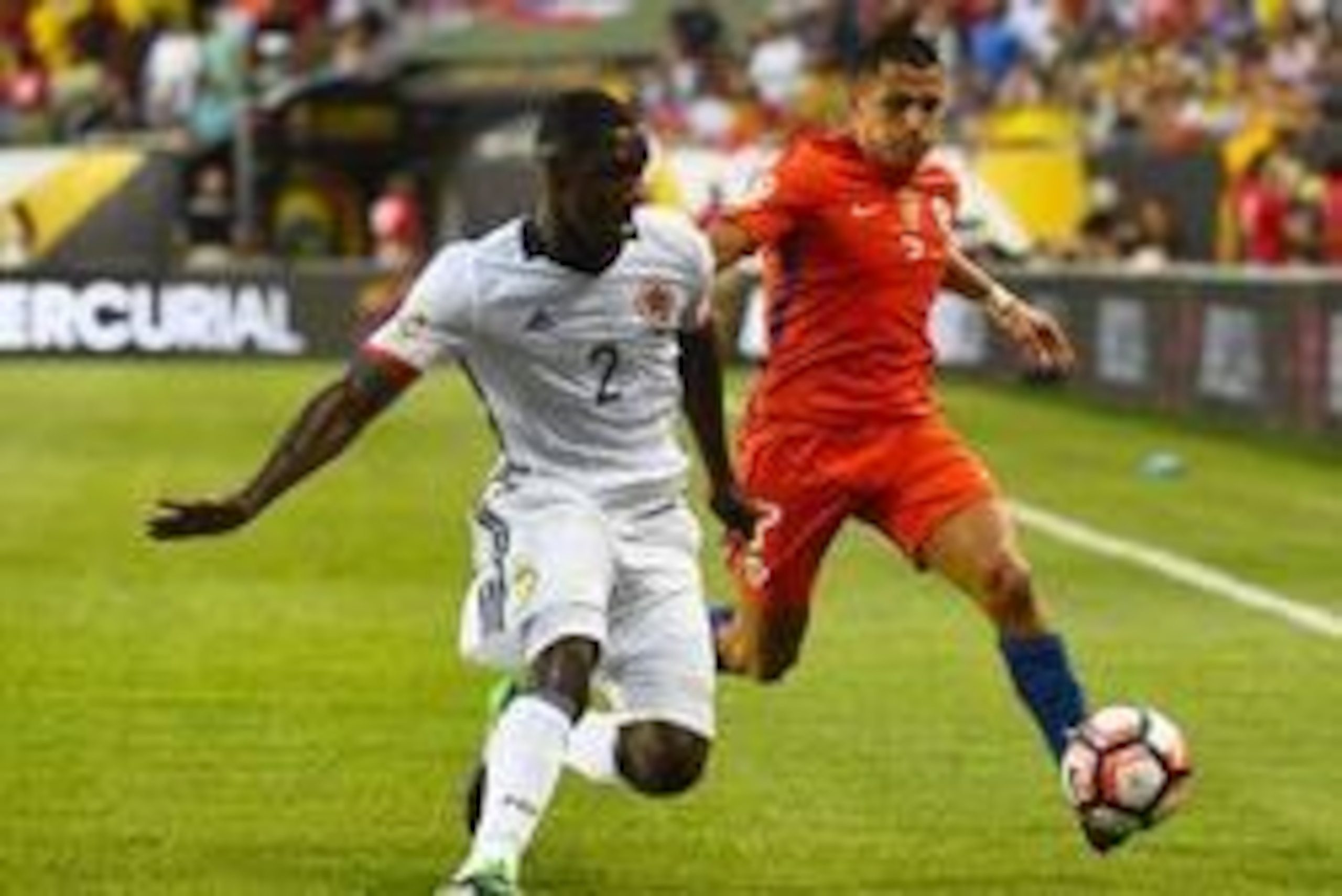 Jun 22, 2016; Chicago, IL, USA; Chile forward Alexis Sanchez (7) kicks the ball past Colombia defender Cristian Zapata (2) during the first half in the semifinals of the 2016 Copa America Centenario soccer tournament at Soldier Field. Mandatory Credit: Mi