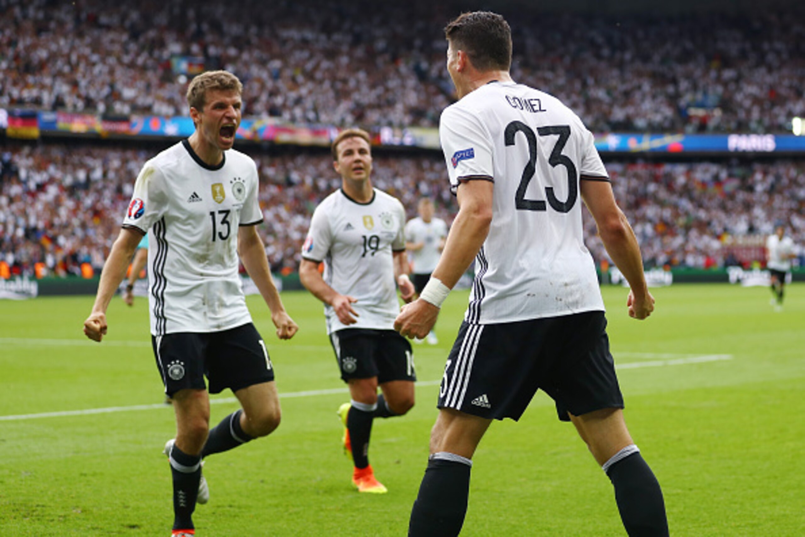 PARIS, FRANCE - JUNE 21:  Mario Gomez (R) of Germany celebrates scoring the opening goal with his team mate Thomas Mueller (L) during the UEFA EURO 2016 Group C match between Northern Ireland and Germany at Parc des Princes on June 21, 2016 in Paris, Fran