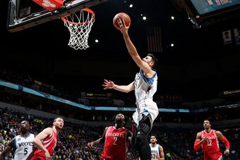 MINNEAPOLIS, MN -  APRIL 11: Ricky Rubio #9 of the Minnesota Timberwolves goes for the layup during the game against the Houston Rockets on April 11, 2016 at Target Center in Minneapolis, Minnesota. NOTE TO USER: User expressly acknowledges and agrees tha