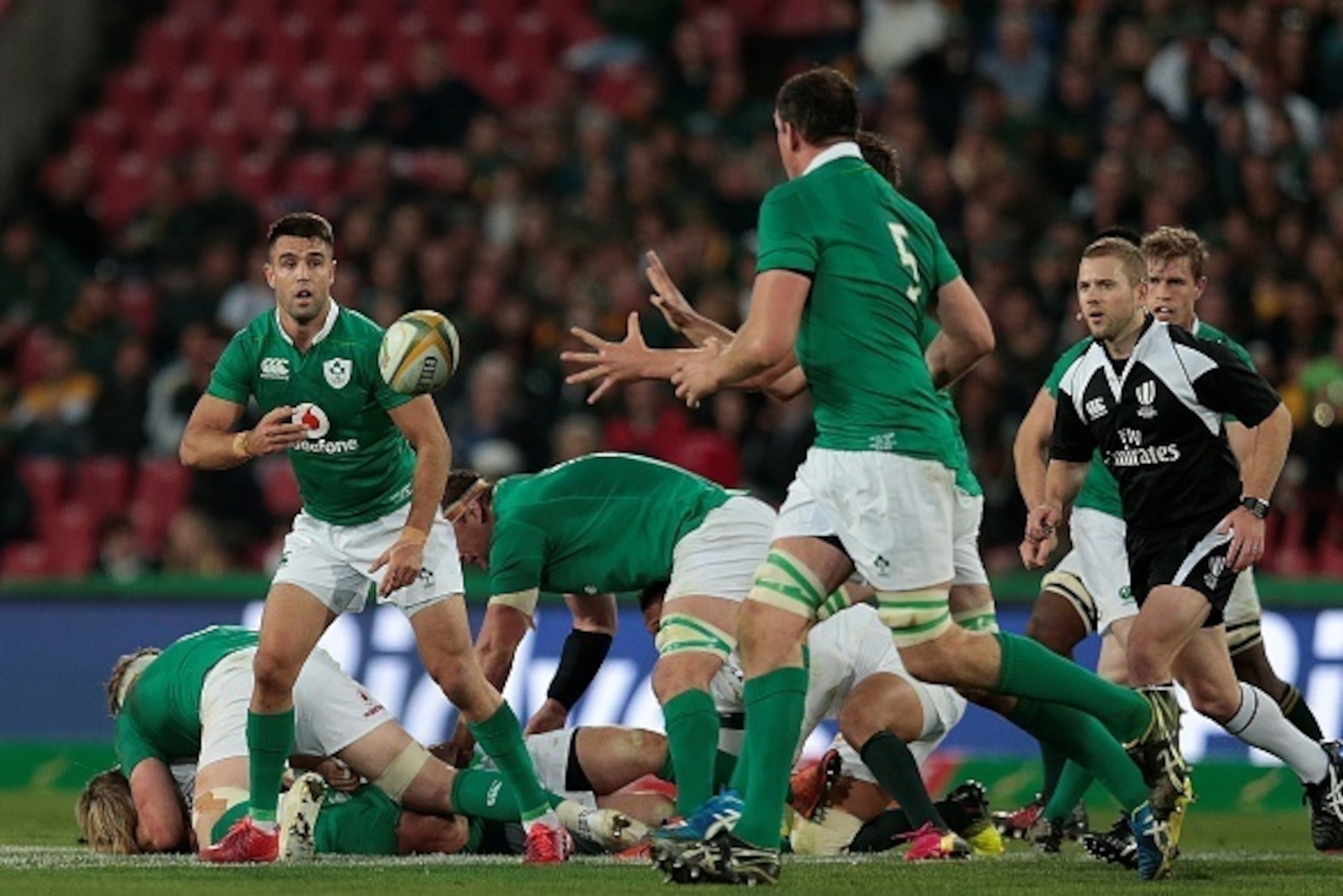 Ireland's scrumhalf Conor Murray (L) clears the ball during the second Rugby Test match between South Africa and Ireland at Ellis Park on June 18, 2016 in Johannesburg. / AFP / Gianluigi GUERCIA        (Photo credit should read GIANLUIGI GUERCIA/AFP/Getty