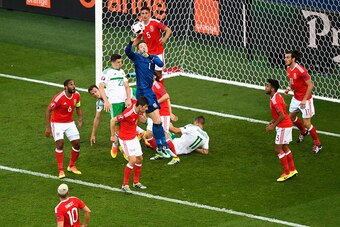 PARIS, FRANCE - JUNE 25: Wayne Hennessey of Wales punches the ball to clear during the UEFA EURO 2016 round of 16 match between Wales and Northern Ireland at Parc des Princes on June 25, 2016 in Paris, France.  (Photo by Mike Hewitt/Getty Images)