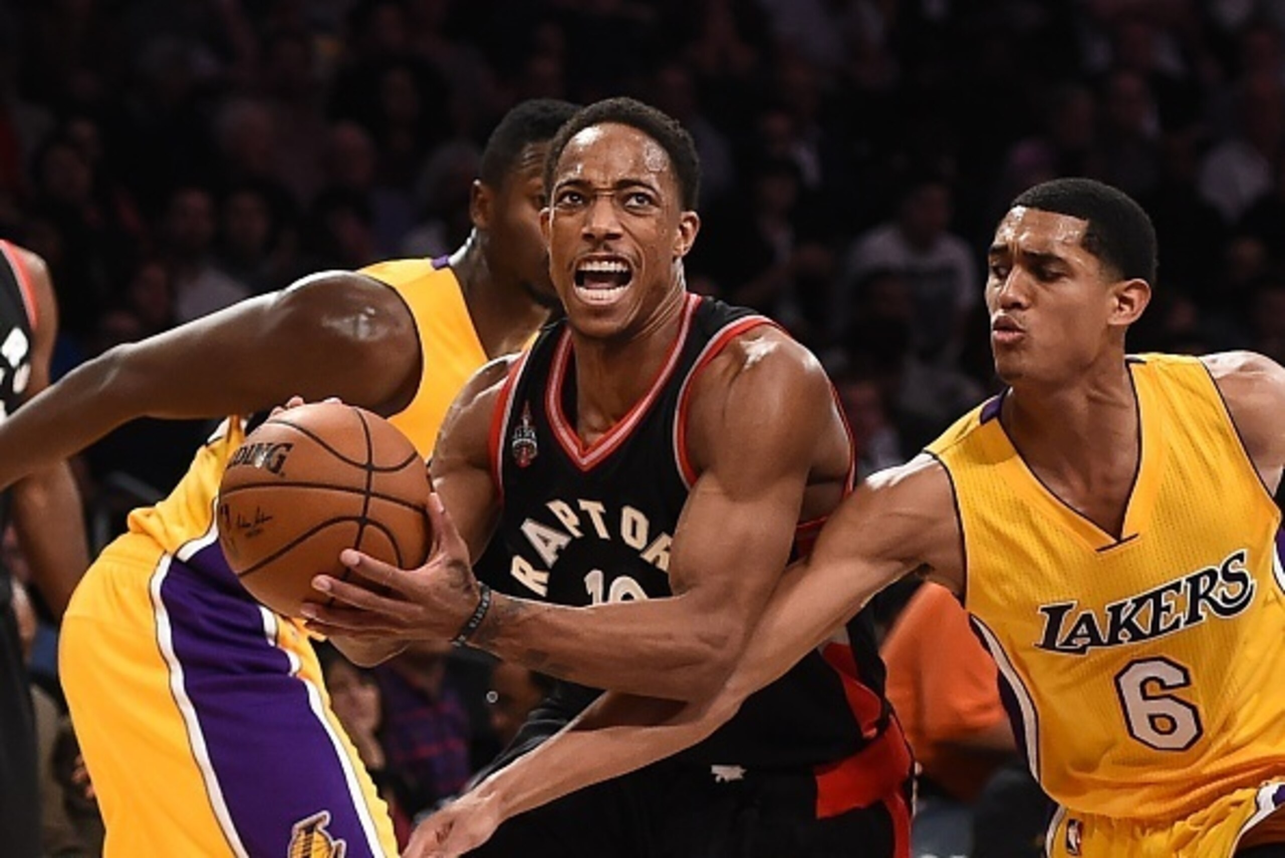 DeMar DeRozan (10) of the Toronto Raptors drives past Jordan Clarkson (6) of the Los Angeles Lakers during their NBA action, November 20, 2015 at Staples Center in Los Angeles, California. AFP PHOTO / ROBYN BECK (Photo credit should read ROBYN BECK DeMar DeRozan (10) of the Toronto Raptors drives past Jordan Clarkson (6) of the Los Angeles Lakers during their NBA action, November 20, 2015 at Staples Center in Los Angeles, California. AFP PHOTO / ROBYN BECK (Photo credit should read ROBYN BECK