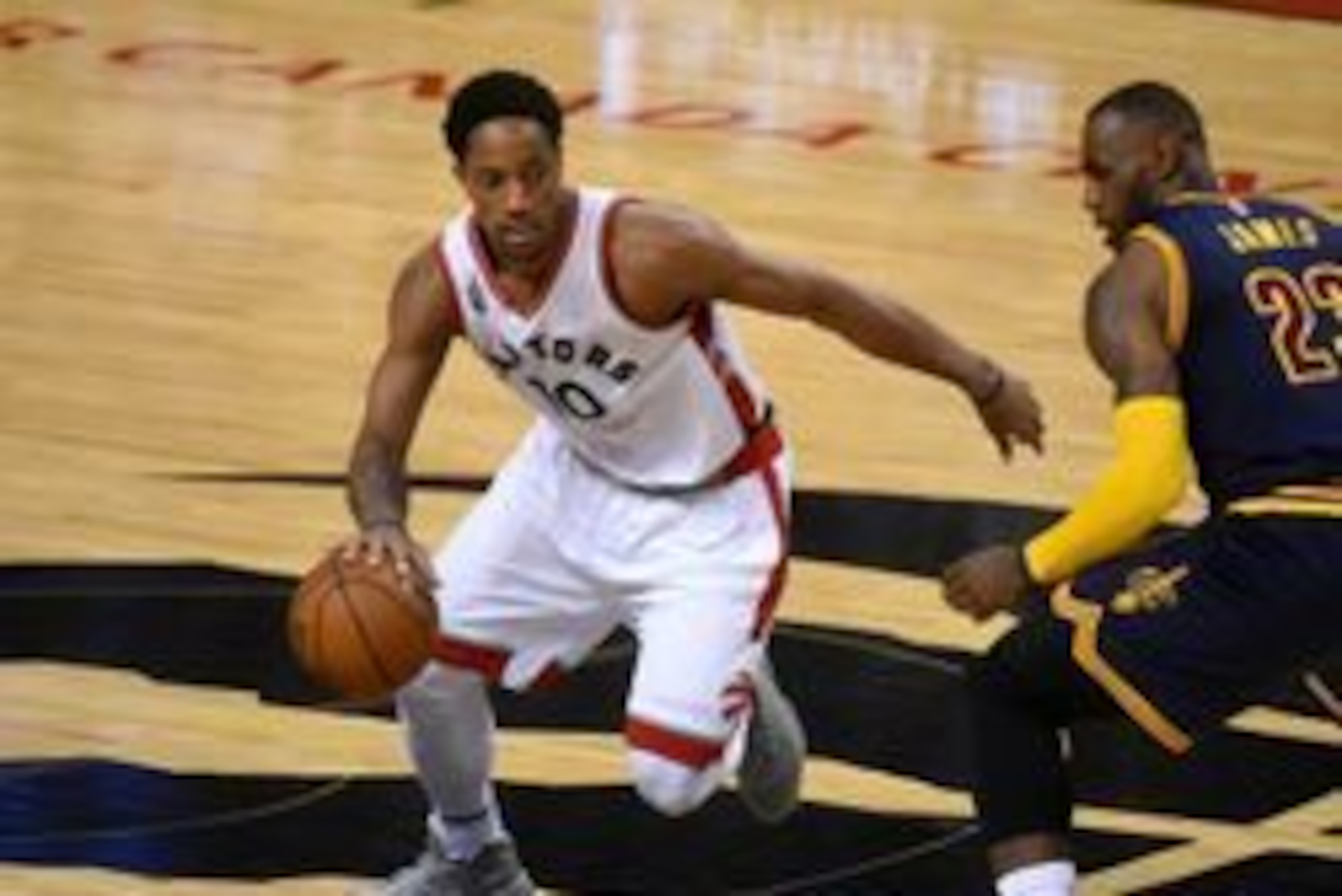 May 21, 2016; Toronto, Ontario, CAN; Toronto Raptors guard DeMar DeRozan (10) dribbles the ball past Cleveland Cavaliers forward LeBron James (23) in game three of the Eastern conference finals of the NBA Playoffs at Air Canada Centre. Mandatory Credit: D May 21, 2016; Toronto, Ontario, CAN; Toronto Raptors guard DeMar DeRozan (10) dribbles the ball past Cleveland Cavaliers forward LeBron James (23) in game three of the Eastern conference finals of the NBA Playoffs at Air Canada Centre. Mandatory Credit: D