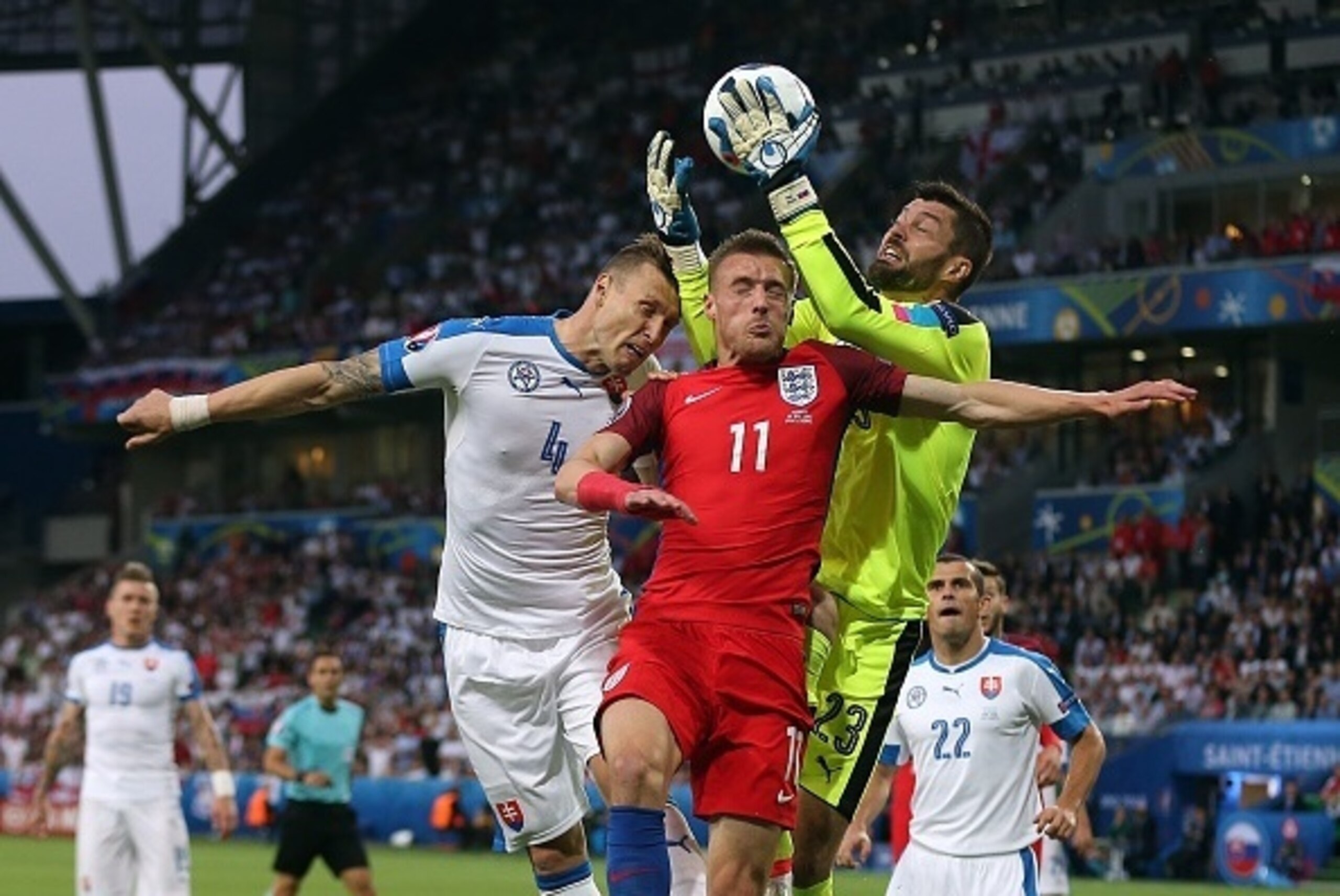 SAINT-ETIENNE, FRANCE - JUNE 20: Matus Kozacik of Slovakia and team-mate Jan Durica jump for a header with Jamie Vardy of England during the UEFA Euro 2016 Group B match between Slovakia and England at Stade Geoffroy-Guichard on June 20, 2016 in Saint-Eti SAINT-ETIENNE, FRANCE - JUNE 20: Matus Kozacik of Slovakia and team-mate Jan Durica jump for a header with Jamie Vardy of England during the UEFA Euro 2016 Group B match between Slovakia and England at Stade Geoffroy-Guichard on June 20, 2016 in Saint-Eti