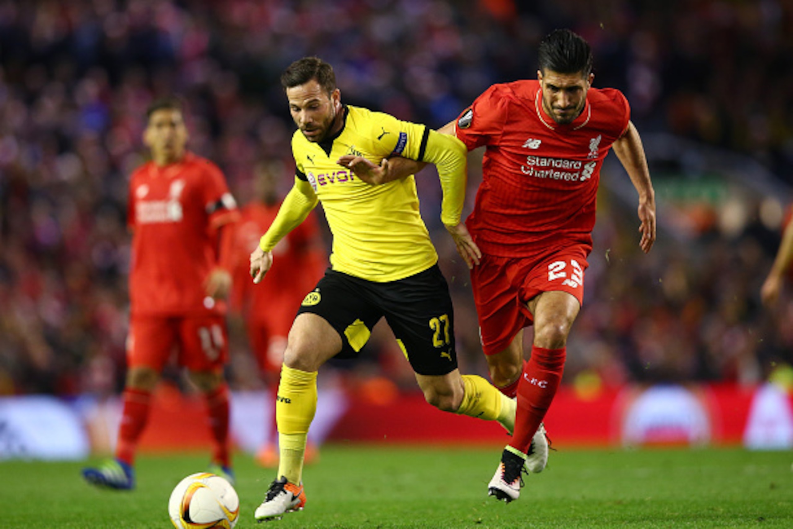 LIVERPOOL, ENGLAND - APRIL 14: Gonzalo Castro of Borussia Dortmund and Emre Can of Liverpool battle for the ball during the UEFA Europa League quarter final, second leg match between Liverpool and Borussia Dortmund at Anfield on April 14, 2016 in Liverpo LIVERPOOL, ENGLAND - APRIL 14: Gonzalo Castro of Borussia Dortmund and Emre Can of Liverpool battle for the ball during the UEFA Europa League quarter final, second leg match between Liverpool and Borussia Dortmund at Anfield on April 14, 2016 in Liverpo