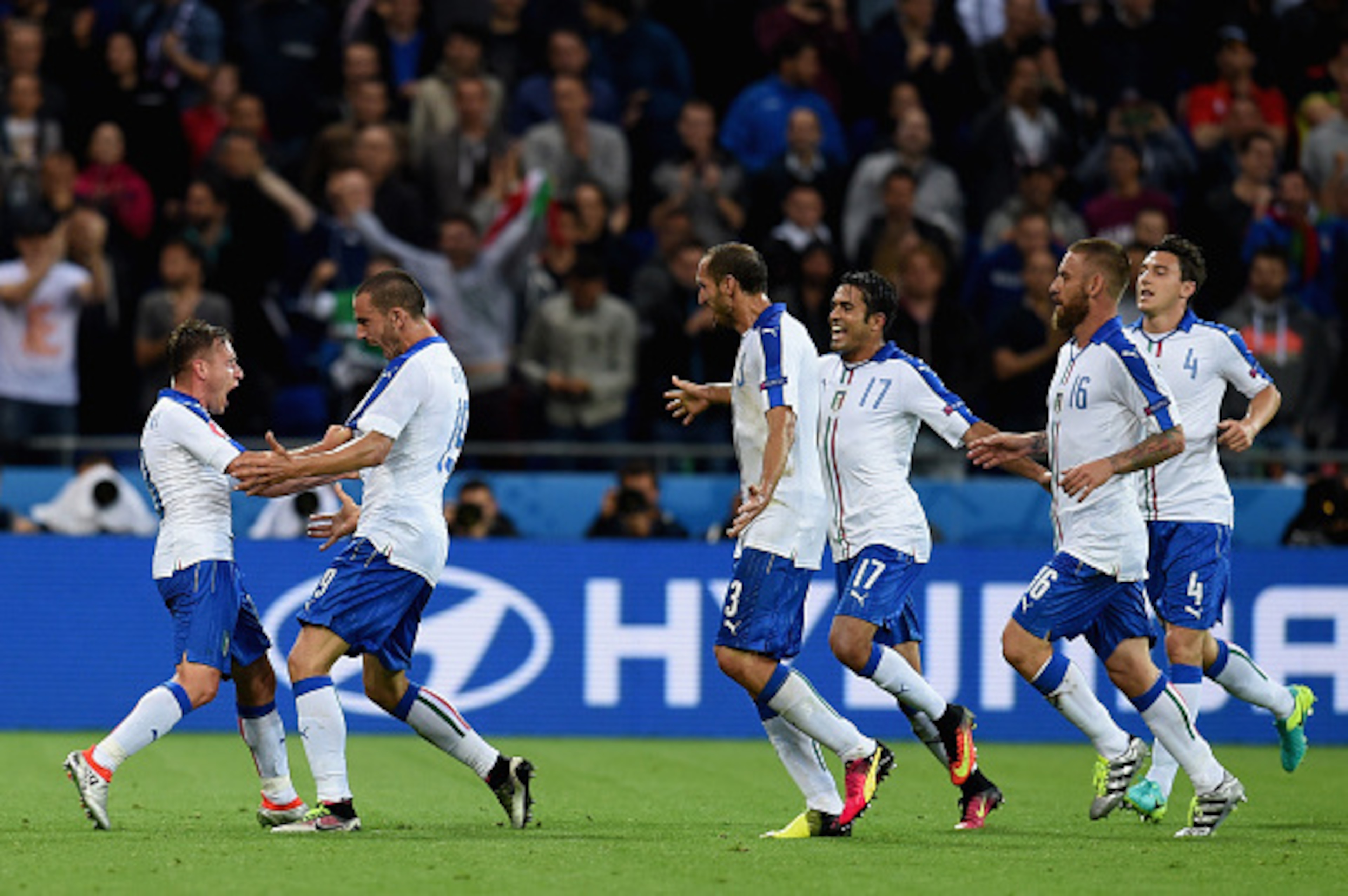 Emanuele Giaccherini (1st L) of Italy celebrates scoring his team's first goal with his team mates during the UEFA EURO 2016 Group E match between Belgium and Italy at Stade des Lumieres on June 13, 2016 in Lyon, France.