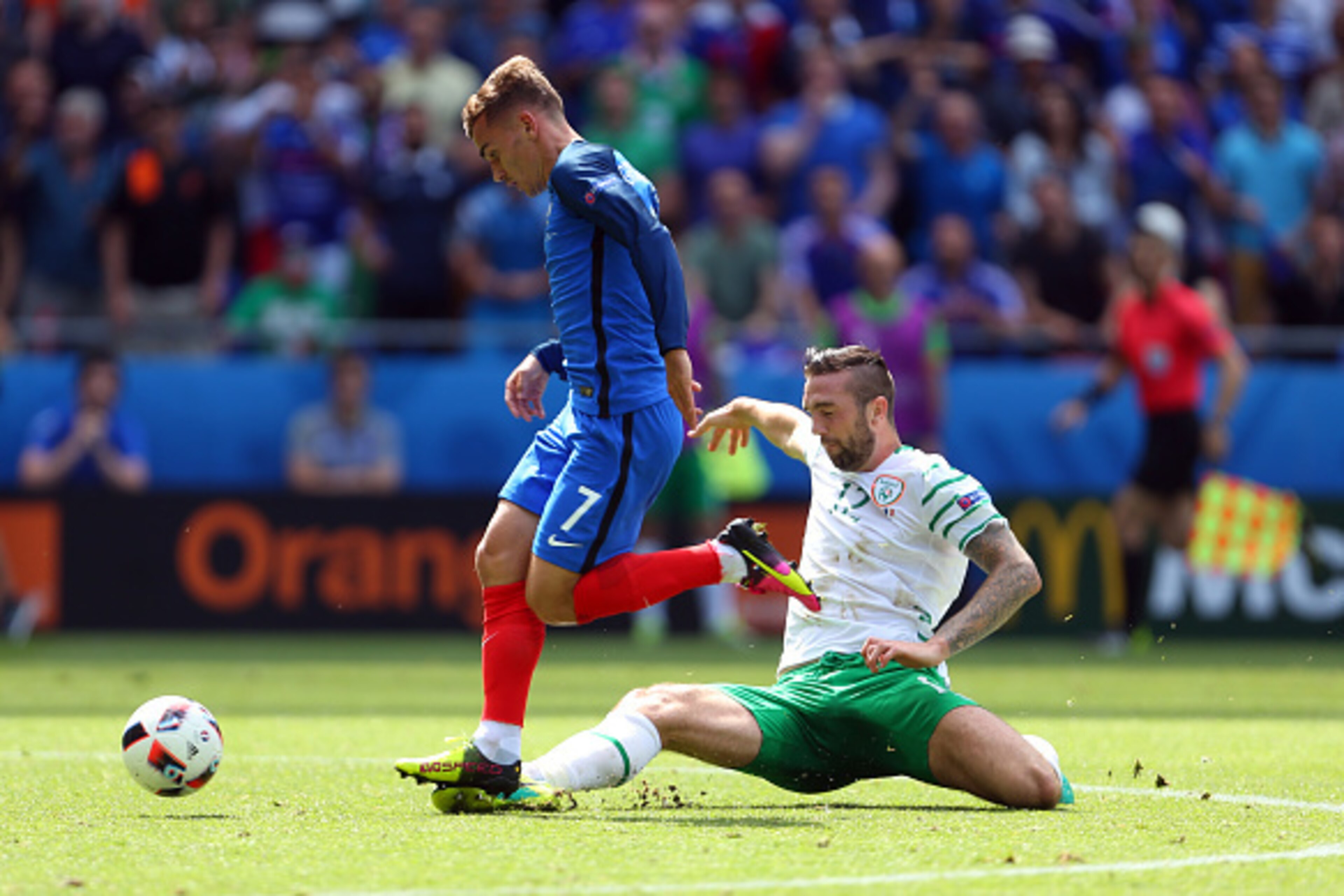 LYON, FRANCE - JUNE 26: Shane Duffy of Republic of Ireland tackles Antoine Griezmann of France and is subsequently sent off during the UEFA EURO 2016 Round of 16 match between France and Republic of Ireland at Stade des Lumieres on June 26, 2016 in Lyon, 
