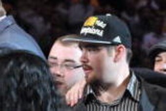 LOS ANGELES - JUNE 17: NBA Commissioner David Stern presents the Larry O'Brien Trophy to Owners Dr. Jerry Buss and Legend Magic Johnson of the Los Angeles Lakers after defeating the Boston Celtics 83-79 in Game Seven of the 2010 NBA Finals on June 17, 201