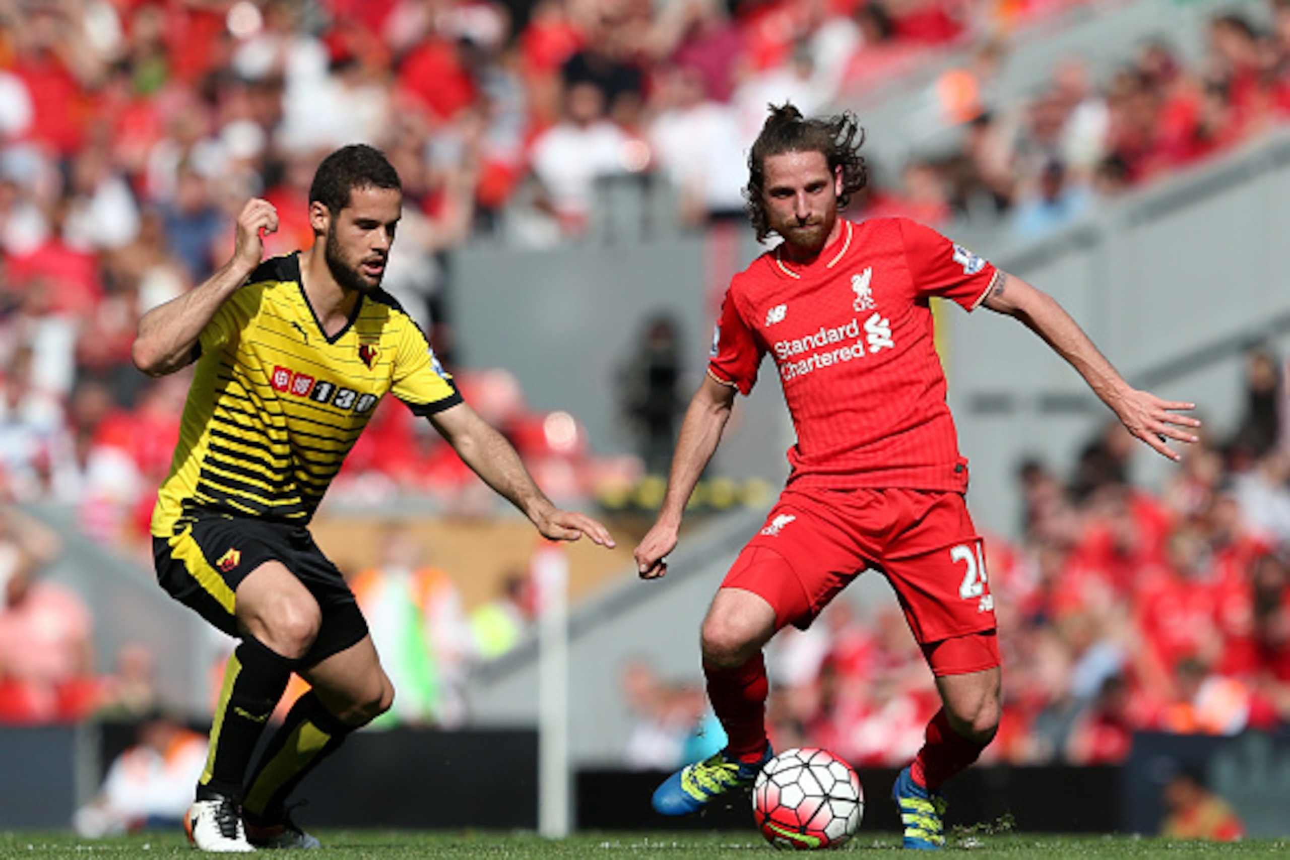LIVERPOOL, ENGLAND - MAY 08:  Joe Allen of Liverpool (r) holds off Mario Suarez of Watford during the Barclays Premier League match between Liverpool and Watford at Anfield on May 8, 2016 in Liverpool, England.  (Photo by Jan Kruger/Getty Images)