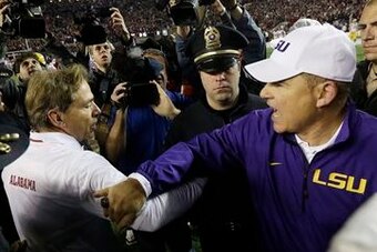 These handshakes haven't gone very well for Les Miles recently.