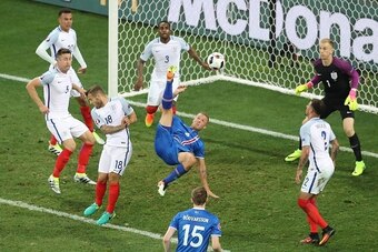 Iceland's defender Ragnar Sigurdsson (C) has an attempt on the goal during the Euro 2016 round of 16 football match between England and Iceland at the Allianz Riviera stadium in Nice on June 27, 2016. / AFP / Valery HACHE        (Photo credit should read 