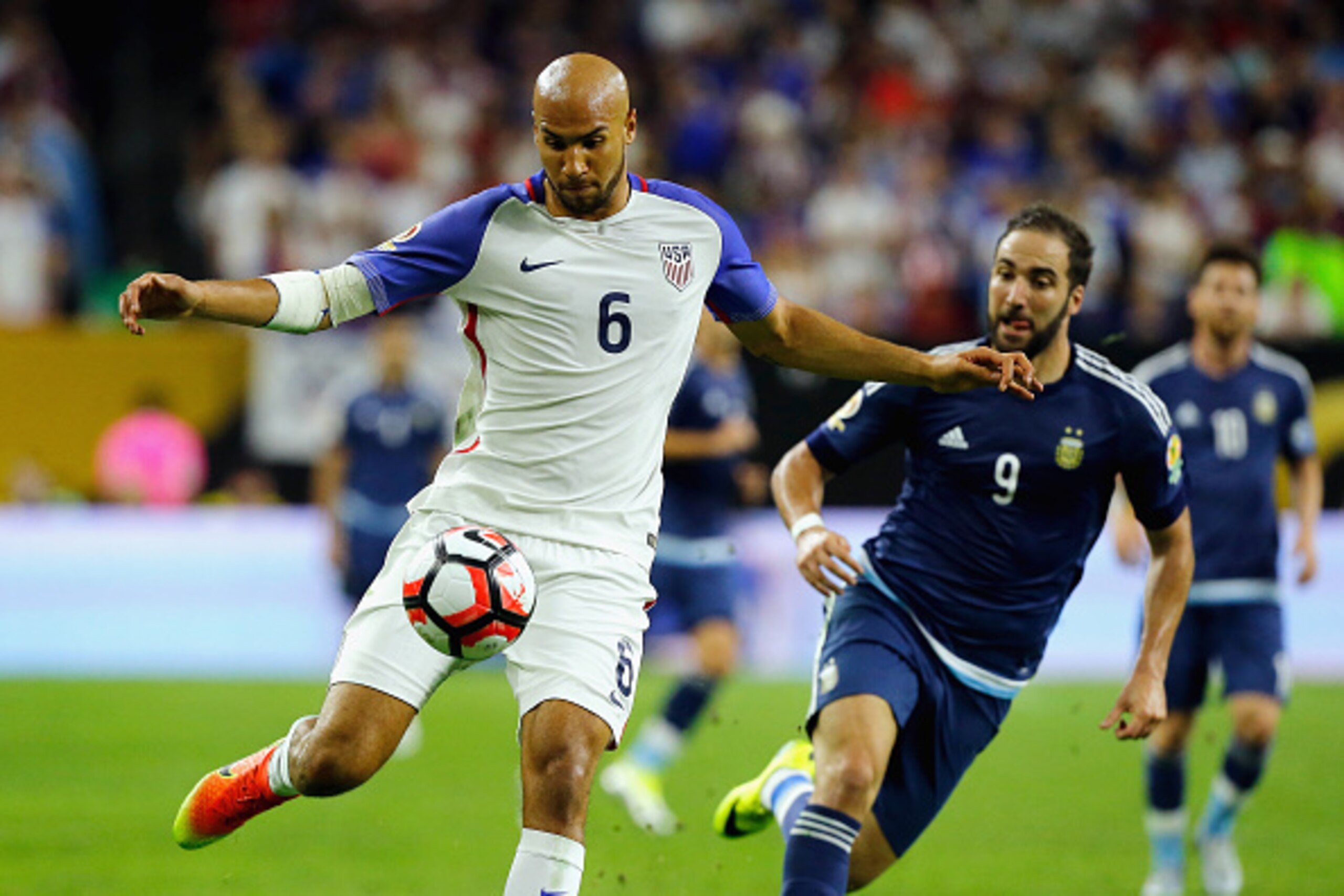 HOUSTON, TX - JUNE 21:  John Brooks #6 of United States handles the ball against Gonzalo Higuain #9 of Argentina in the second half during a 2016 Copa America Centenario Semifinal match at NRG Stadium on June 21, 2016 in Houston, Texas.  (Photo by Bob Lev
