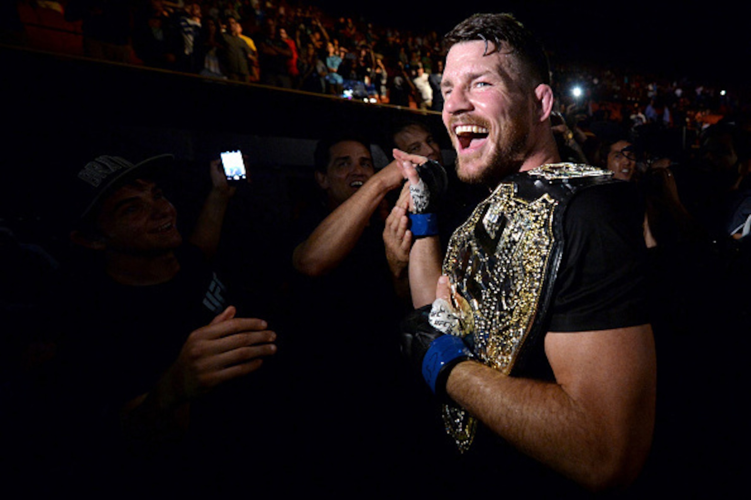 INGLEWOOD, CA - JUNE 04:  Michael Bisping of England celebrates with his title belt after his first round knockout win against Luke Rockhold during the UFC 199 event at The Forum on June 4, 2016 in Inglewood, California.  (Photo by Brandon Magnus/Zuffa LL