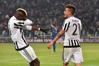 TURIN, ITALY - JANUARY 24:  Paulo Dybala (R) of Juventus FC celebrates after scoring the opening goal with team mate Paul Pogba during the Serie A match between Juventus FC and AS Roma at Juventus Arena on January 24, 2016 in Turin, Italy.  (Photo by Vale