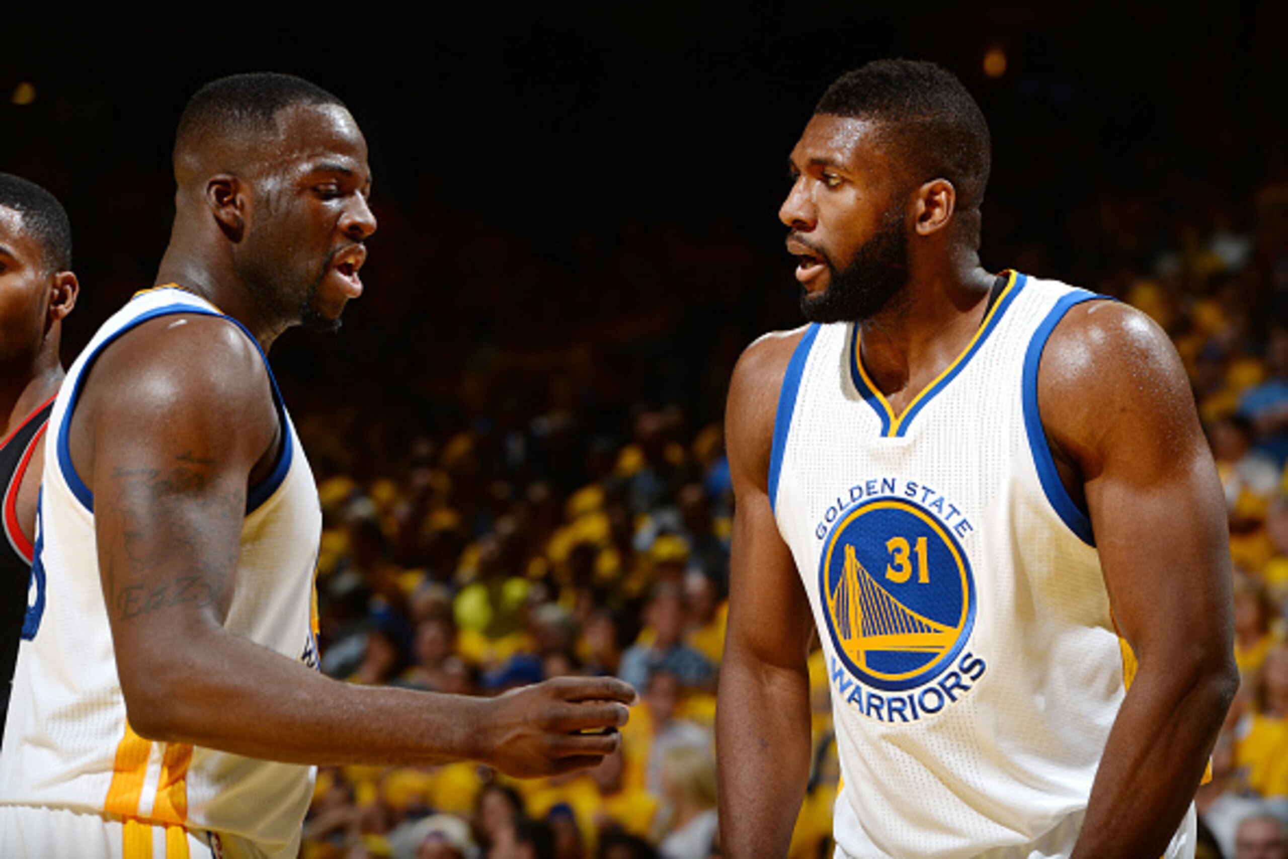 OAKLAND, CA - MAY 3: Festus Ezeli #31 and Draymond Green #23 of the Golden State Warriors talk to each other during the game against the Portland Trail Blazers in Game Two of the Western Conference Semifinals during the 2016 NBA Playoffs on May 3, 2016 at OAKLAND, CA - MAY 3: Festus Ezeli #31 and Draymond Green #23 of the Golden State Warriors talk to each other during the game against the Portland Trail Blazers in Game Two of the Western Conference Semifinals during the 2016 NBA Playoffs on May 3, 2016 at