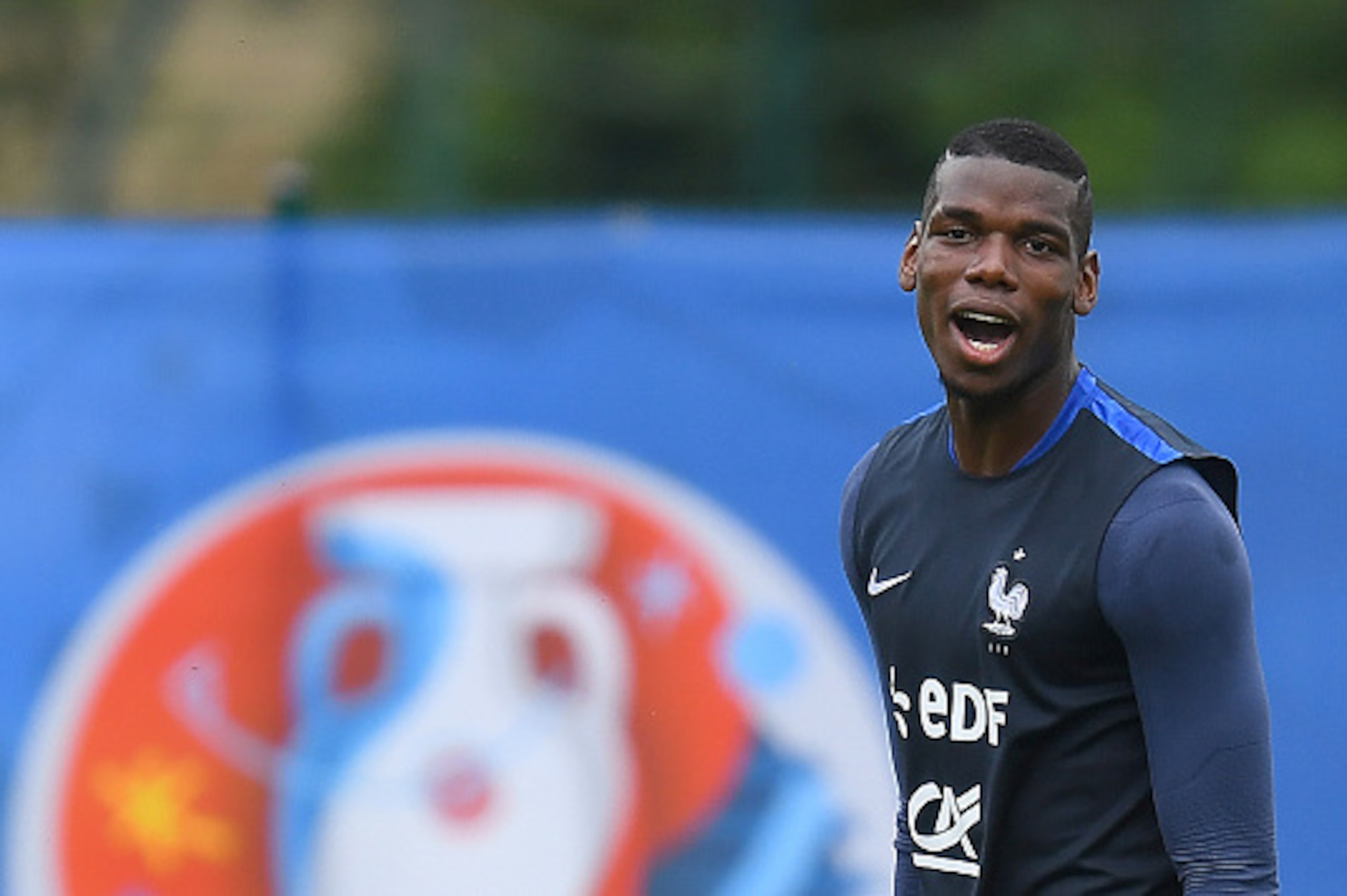 France's midfielder Paul Pogba reacts at the end of a training session in Clairefontaine en Yvelines on June 21, 2016, during the Euro 2016 football tournament.   / AFP / FRANCK FIFE        (Photo credit should read FRANCK FIFE/AFP/Getty Images)