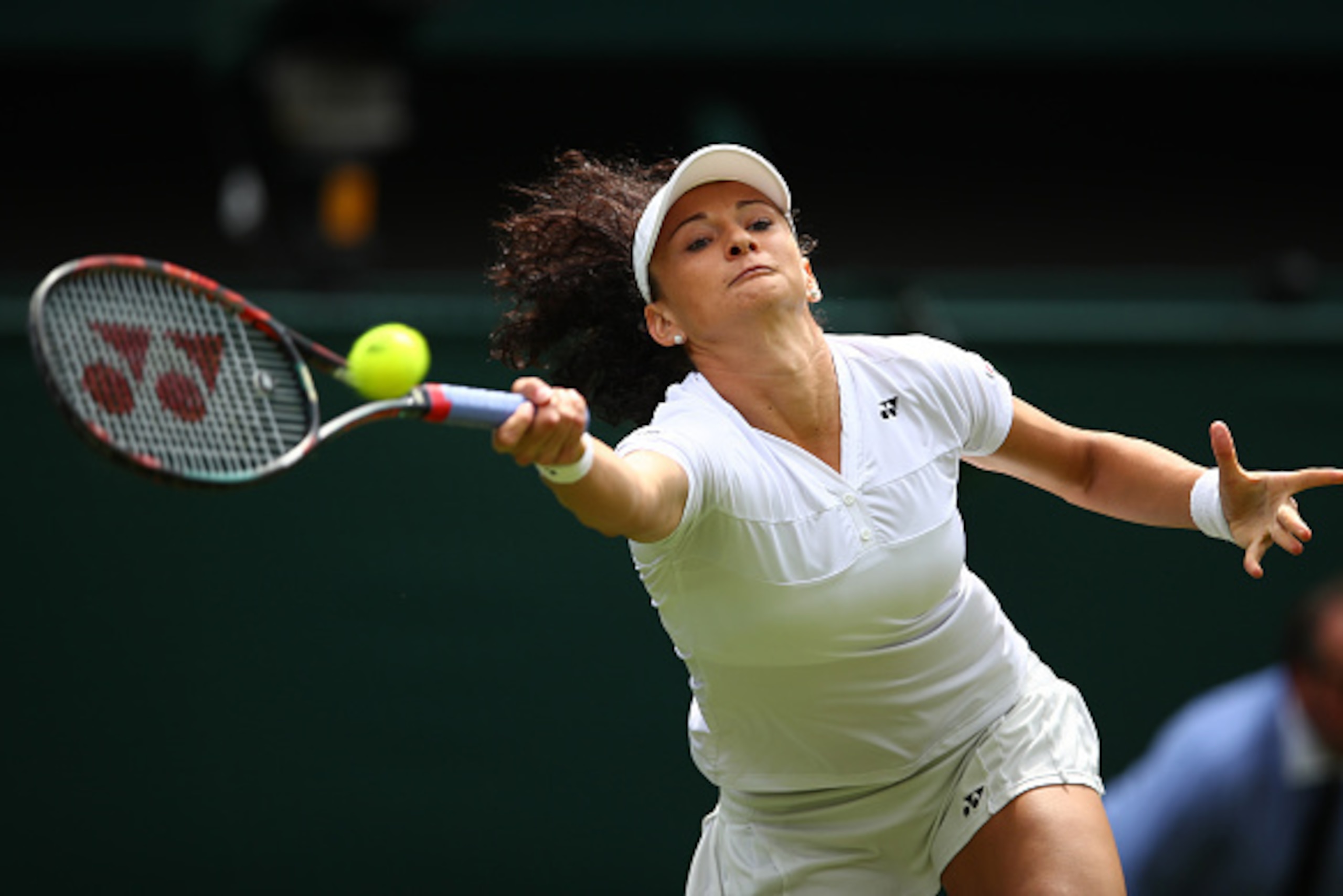LONDON, ENGLAND - JUNE 28:  Amra Sadikovic of Switzerland plays a forehand during the LadiesSingles first round match against Serena Williams of The United States on day two of the Wimbledon Lawn Tennis Championships at the All England Lawn Tennis and Cro