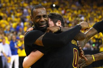 OAKLAND, CA - JUNE 19:  LeBron James #23 and Kevin Love #0 of the Cleveland Cavaliers celebrate after defeating the Golden State Warriors 93-89 in Game 7 of the 2016 NBA Finals at ORACLE Arena on June 19, 2016 in Oakland, California. NOTE TO USER: User ex