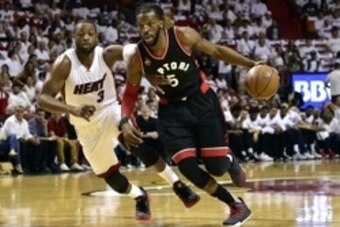 May 7, 2016; Miami, FL, USA; Toronto Raptors forward DeMarre Carroll (5) dribbles the ball past Miami Heat guard Dwyane Wade (3) during the first quarter in game three of the second round of the NBA Playoffs at American Airlines Arena. Mandatory Credit: S