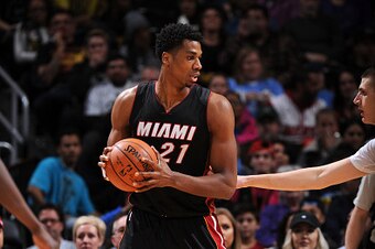 DENVER, CO - JANUARY 15:  Hassan Whiteside #21 of the Miami Heat handles the ball against the Denver Nuggets on January 15, 2016 at the Pepsi Center in Denver, Colorado. NOTE TO USER: User expressly acknowledges and agrees that, by downloading and/or usin