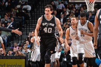 BROOKLYN, NY - JANUARY 11:  Boban Marjanovic #40 of the San Antonio Spurs runs up court against the Brooklyn Nets on January 11, 2015 at Barclays Center in Brooklyn, New York. NOTE TO USER: User expressly acknowledges and agrees that, by downloading and o