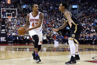 TORONTO, ON - JANUARY 28:  Lance Thomas #42 of the New York Knicks dribbles the ball as DeMar DeRozan #10 of the Toronto Raptors defends during an NBA game at the Air Canada Centre on January 28, 2016 in Toronto, Ontario, Canada.  NOTE TO USER: User expre