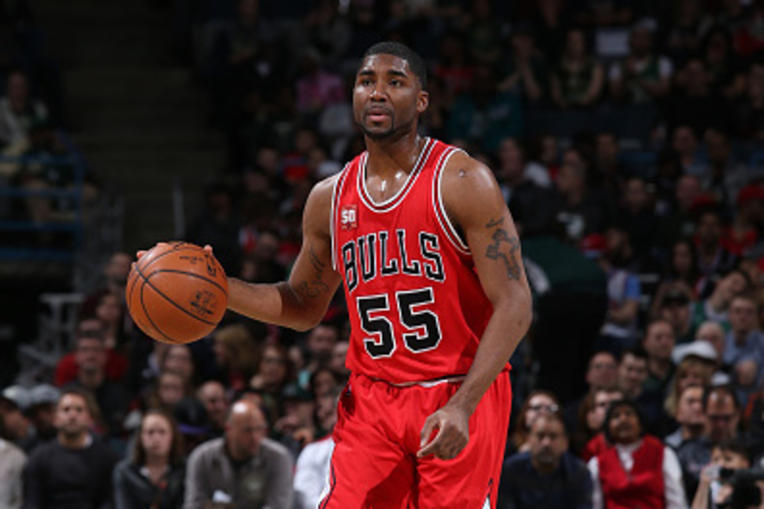 MILWAUKEE, WI - APRIL 3: E'Twaun Moore #55 of the Chicago Bulls brings the ball up court against the Milwaukee Bucks on April 3, 2016 at the BMO Harris Bradley Center in Milwaukee, Wisconsin. NOTE TO USER: User expressly acknowledges and agrees that, by MILWAUKEE, WI - APRIL 3: E'Twaun Moore #55 of the Chicago Bulls brings the ball up court against the Milwaukee Bucks on April 3, 2016 at the BMO Harris Bradley Center in Milwaukee, Wisconsin. NOTE TO USER: User expressly acknowledges and agrees that, by