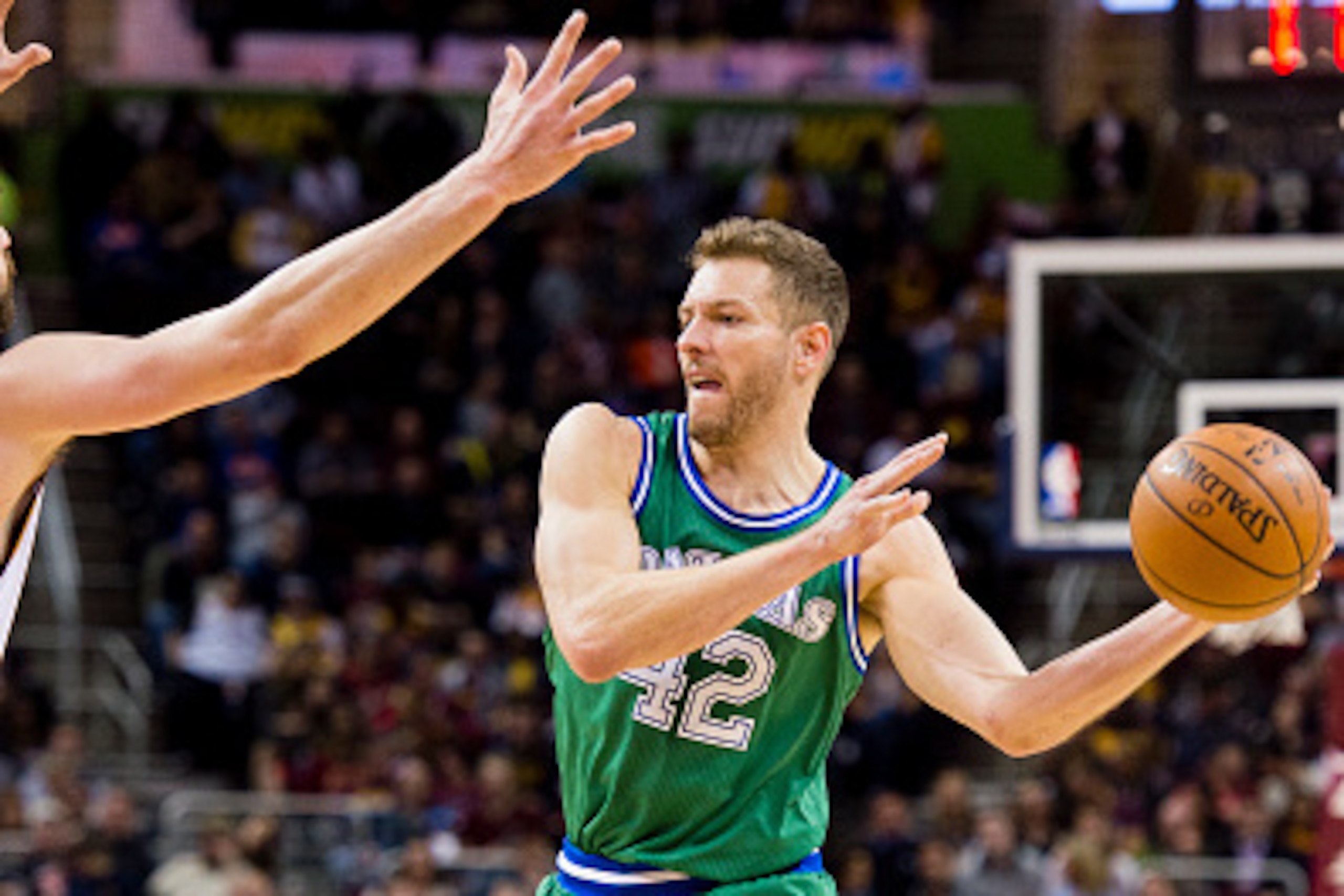 CLEVELAND, OH - MARCH 16: David Lee #42 of the Dallas Mavericks passes while under pressure from Kevin Love #0 of the Cleveland Cavaliers during the first half at Quicken Loans Arena on March 16, 2016 in Cleveland, Ohio. NOTE TO USER: User expressly ackno CLEVELAND, OH - MARCH 16: David Lee #42 of the Dallas Mavericks passes while under pressure from Kevin Love #0 of the Cleveland Cavaliers during the first half at Quicken Loans Arena on March 16, 2016 in Cleveland, Ohio. NOTE TO USER: User expressly ackno