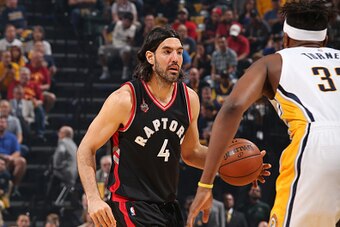 INDIANAPOLIS, IN - APRIL 23: Luis Scola #4 of the Toronto Raptors drives to the basket against the Indiana Pacers during Game Four of the Eastern Conference Quarterfinals during the 2016 NBA Playoffs on April 23, 2016 at Bankers Life Fieldhouse in Indiana