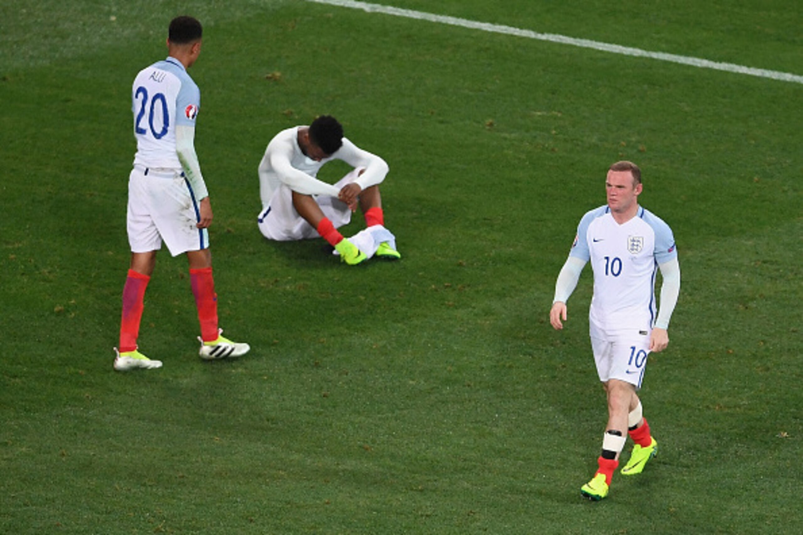 NICE, FRANCE - JUNE 27: Wayne Rooney of England walks from the pitch as Dele Alli and Daniel Sturridge show their dissapointment after defeat during the UEFA Euro 2016 Round of 16 match between England and Iceland at Allianz Riviera Stadium on June 27, 20
