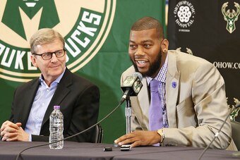 ST. FRANCIS, WI - JULY 9: Recently signed free agents Greg Monroe and Khris Middleton of the Milwaukee Bucks are joined by general manager John Hammond and head coach Jason Kidd during a press conference at the Orthopaedic Hospital of Wisconsin Training C
