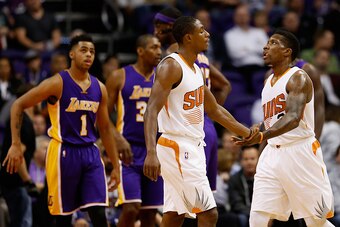 PHOENIX, AZ - NOVEMBER 16:  Eric Bledsoe #2 of the Phoenix Suns high-fives Brandon Knight #3 after scoring against the Los Angeles Lakers during the first half of the NBA game at Talking Stick Resort Arena on November 16, 2015 in Phoenix, Arizona. NOTE TO