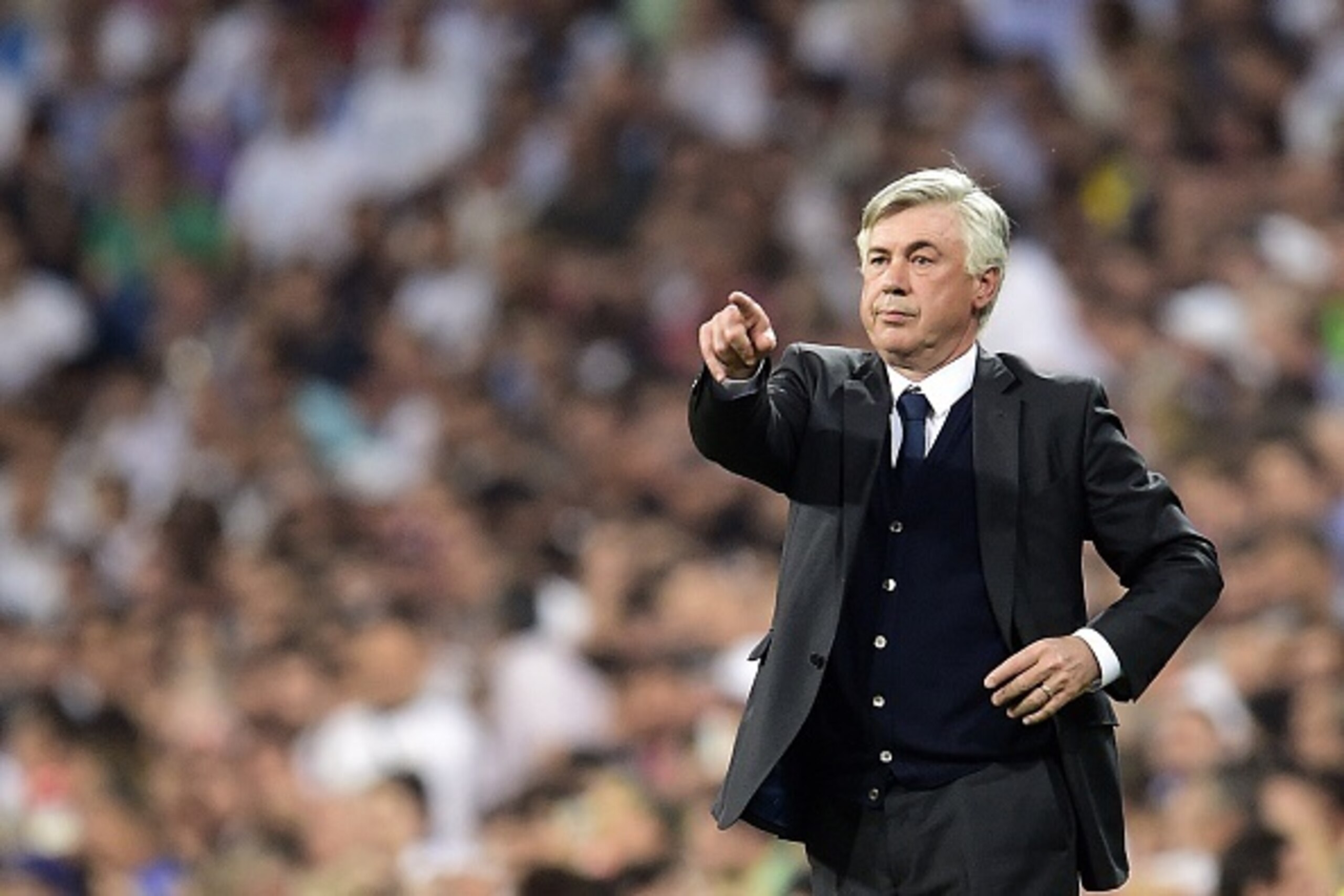 Real Madrid's Italian coach Carlo Ancelotti gestures during the UEFA Champions League semi-final second leg football match Real Madrid FC vs Juventus at the Santiago Bernabeu stadium in Madrid on May 13, 2015.   AFP PHOTO/ GERARD JULIEN        (Photo cred