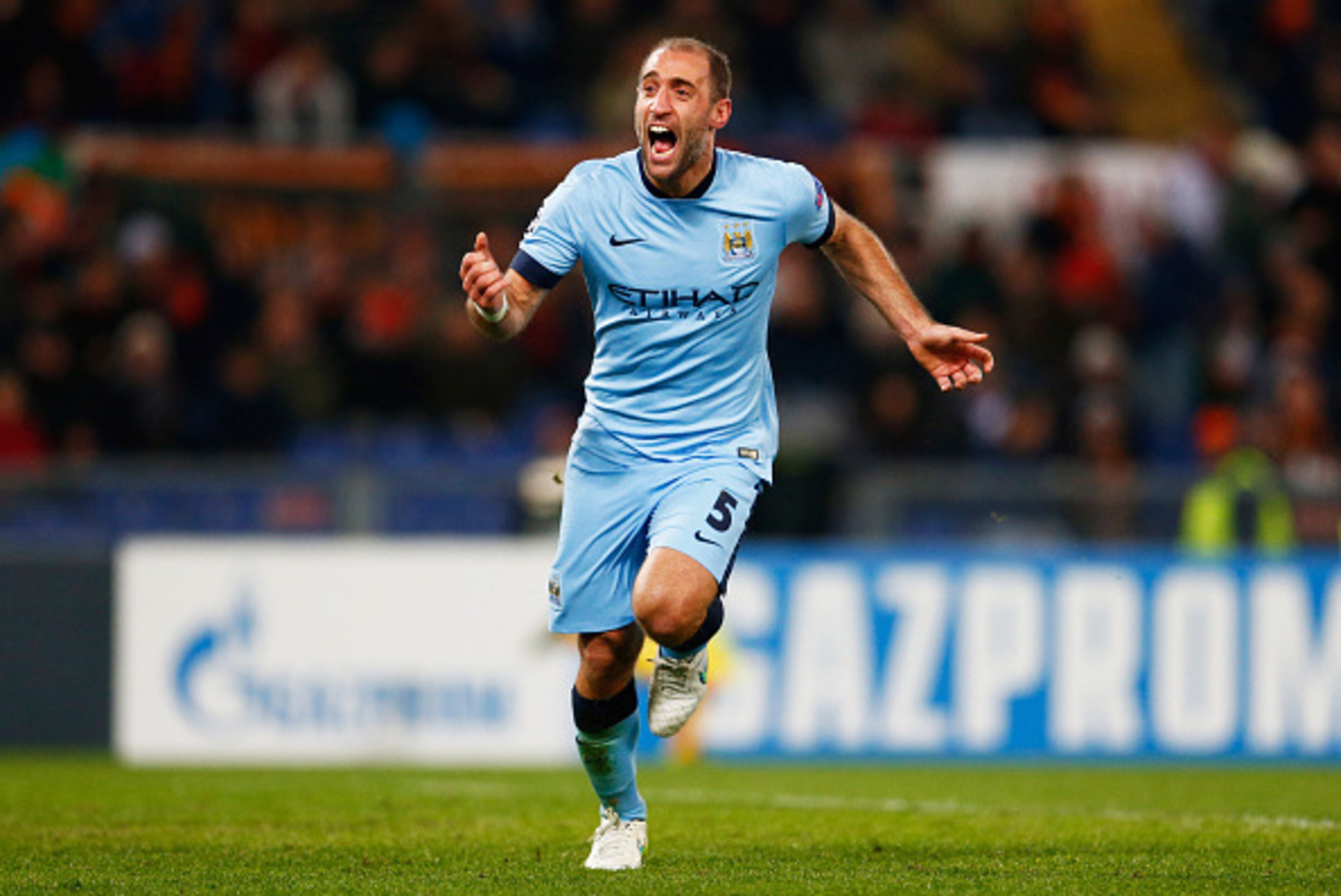ROME, ITALY - DECEMBER 10:  Pablo Zabaleta of Manchester City celebrates as he scores their second goal during the UEFA Champions League Group E match between AS Roma and Manchester City FC at Stadio Olimpico on December 10, 2014 in Rome, Italy.  (Photo b