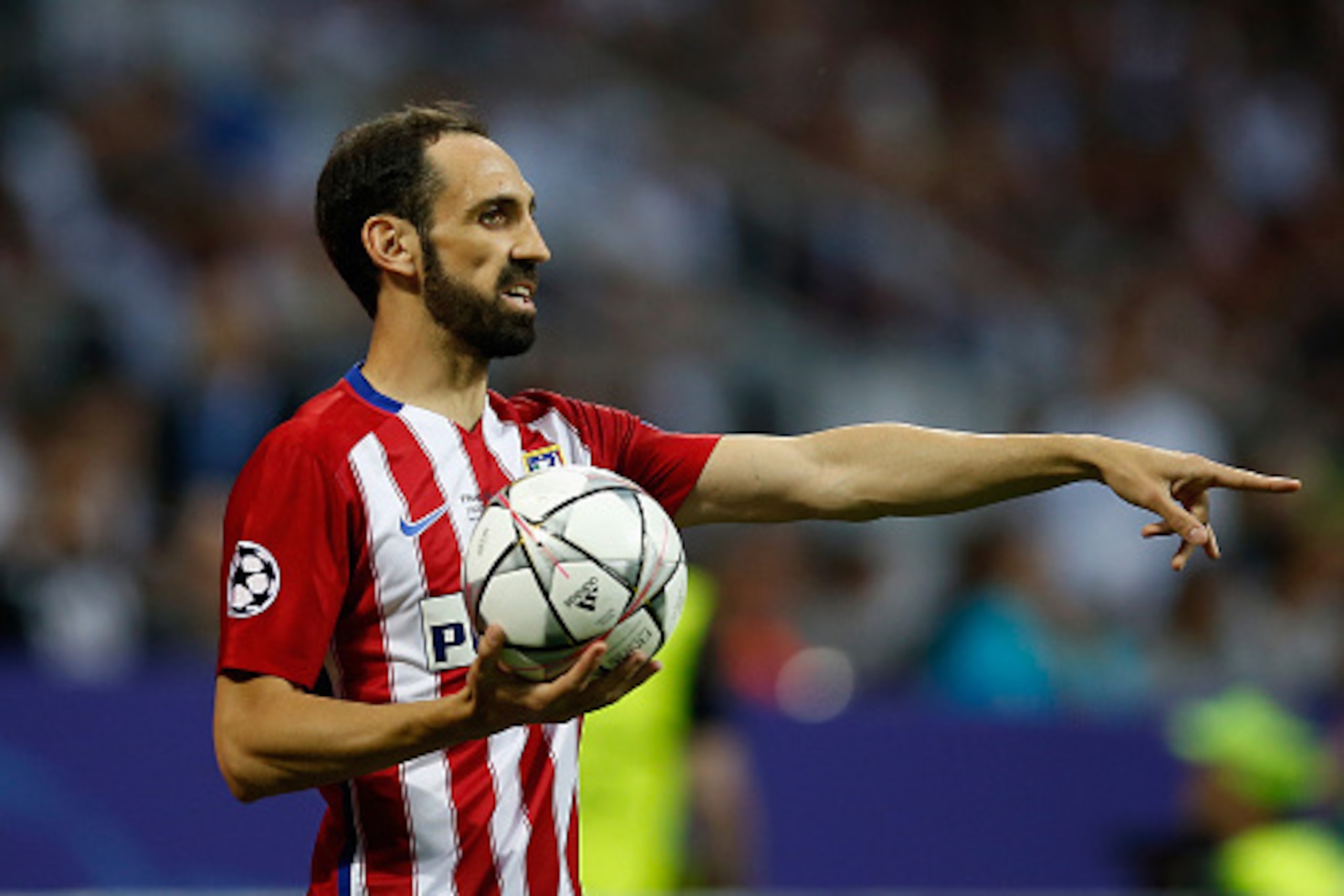 MILAN, ITALY - MAY 28:  Juanfran of Atletico Madrid takes the throw-in during the Champions League final match between Real Madrid and Club Atletico de Madrid at Stadio Giuseppe Meazza on May 28, 2016 in Milan, Italy.  (Photo by Boris Streubel/Getty Image