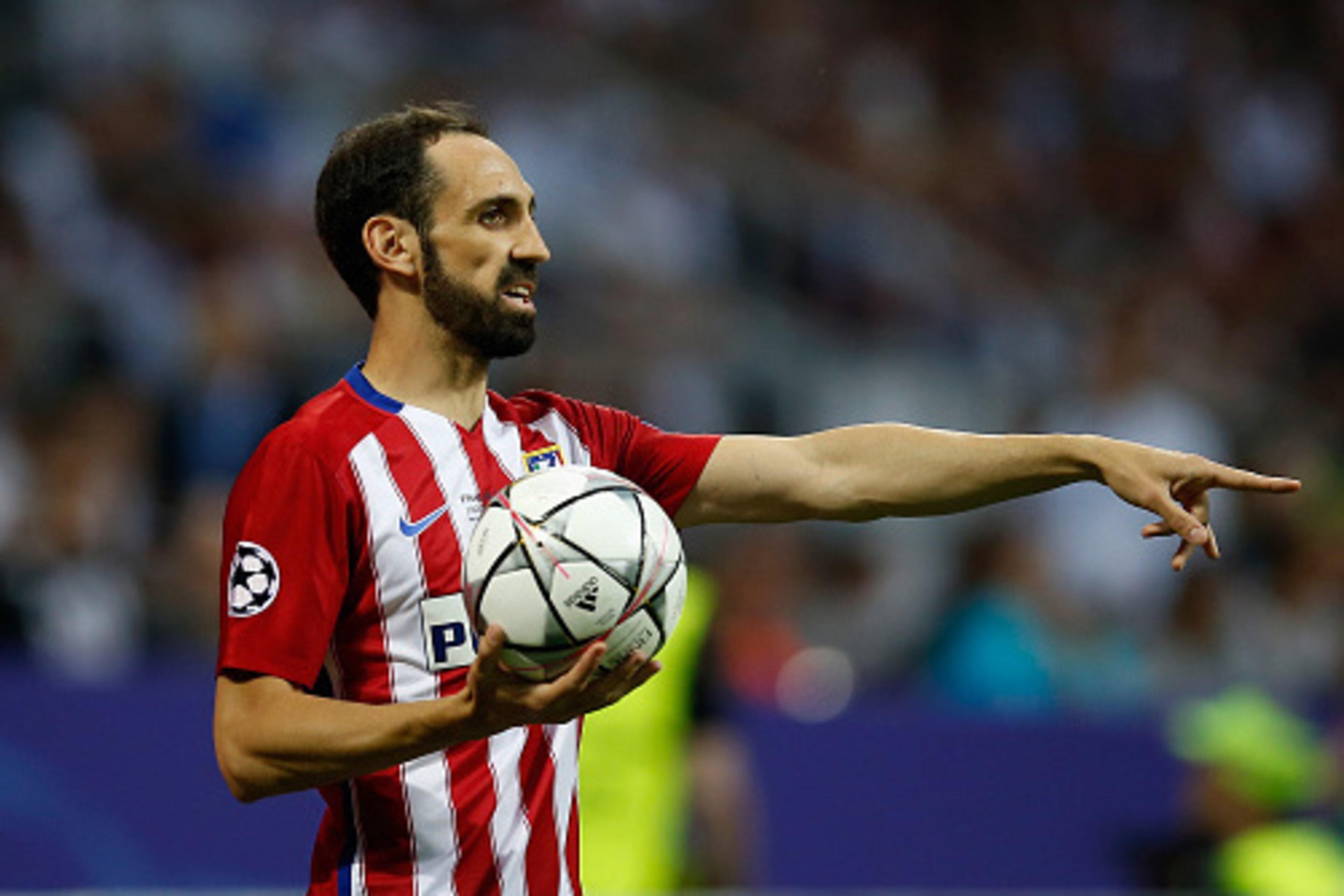 MILAN, ITALY - MAY 28:  Juanfran of Atletico Madrid takes the throw-in during the Champions League final match between Real Madrid and Club Atletico de Madrid at Stadio Giuseppe Meazza on May 28, 2016 in Milan, Italy.  (Photo by Boris Streubel/Getty Image