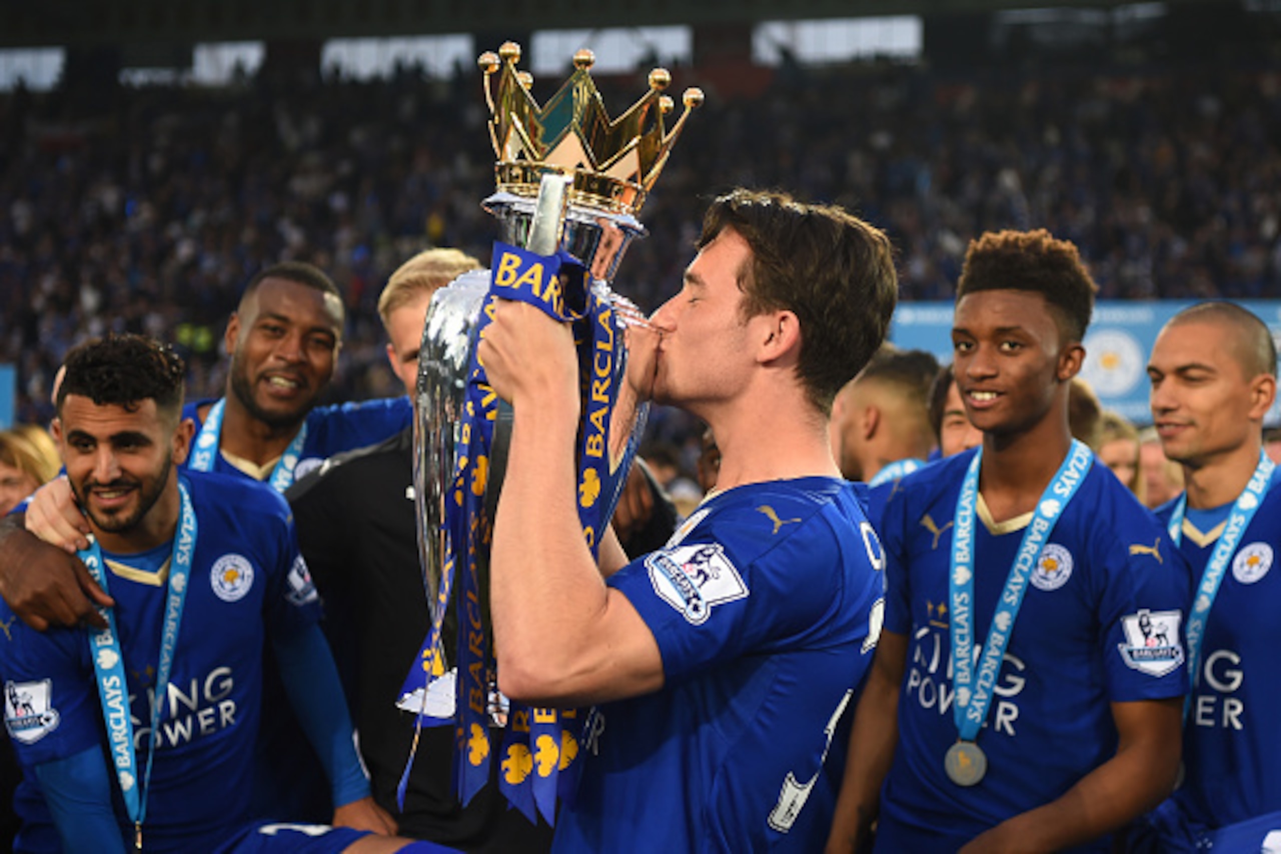 LEICESTER, ENGLAND - MAY 07:  Ben Chilwell of Leicester City poses with the Premier League Trophy as players and staffs celebrate the season champions after the Barclays Premier League match between Leicester City and Everton at The King Power Stadium on 
