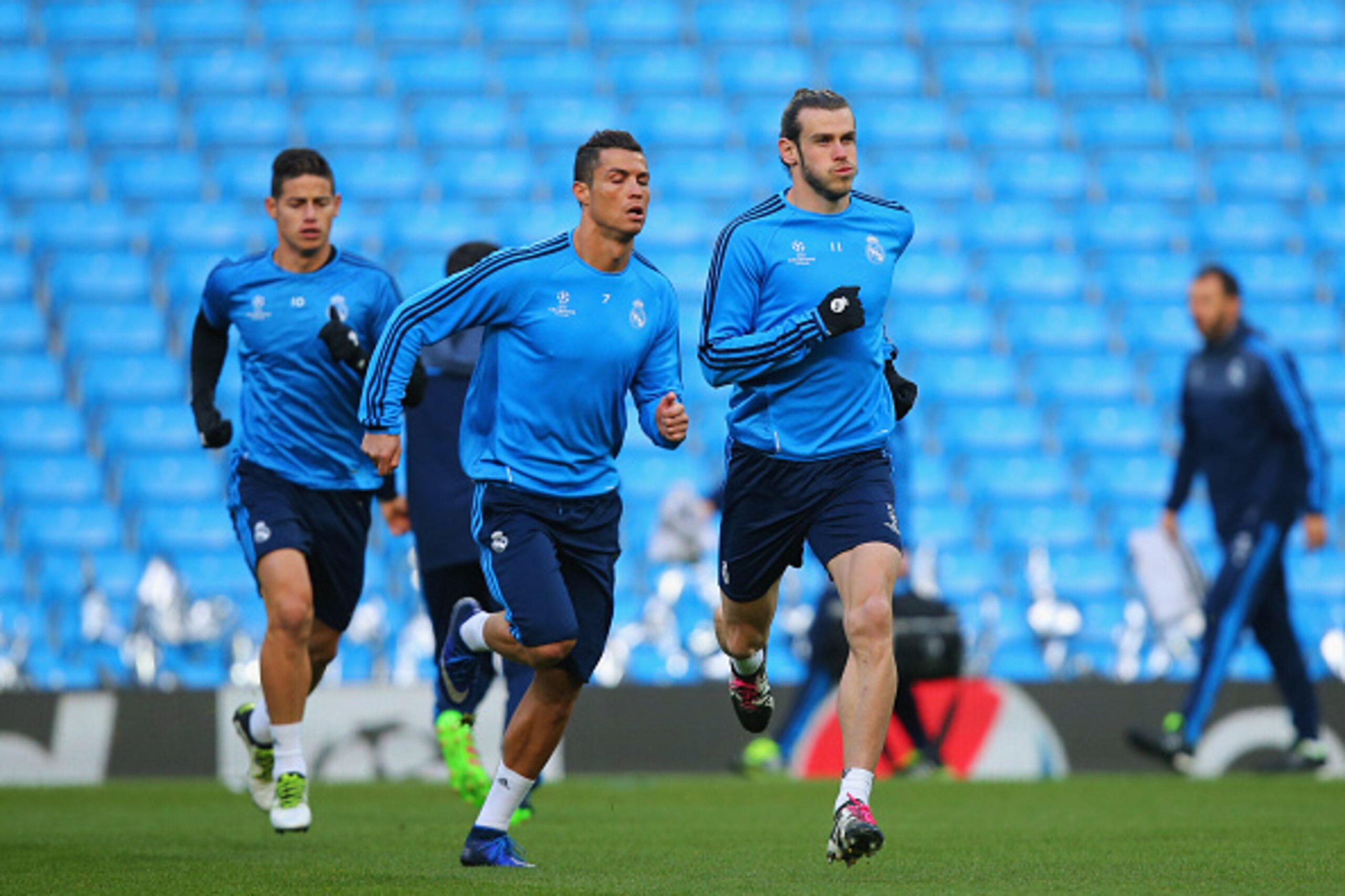 MANCHESTER, ENGLAND - APRIL 25:  James Rodriguez, Cristiano Ronaldo and Gareth Bale of Real Madrid run during a Real Madrid training session on the eve of their UEFA Champions League semi final first leg match against Manchester City at the Etihad Stadium