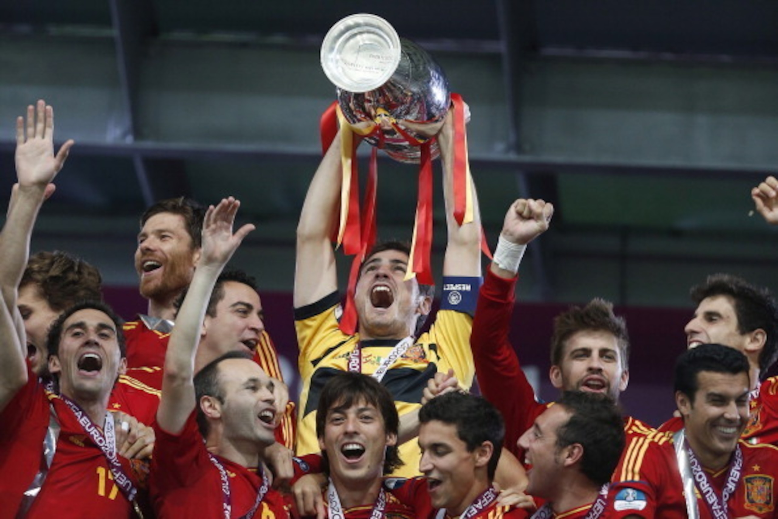 Goalkeeper Iker Casillas of Spain lifts the trophy as his team celebrate victory in the UEFA EURO 2012 Final match between Spain and Italy at the NSK Olimpiejsky Stadium on July 01, 2012 in Kiev, Ukraine. (Photo by VI Images via Getty Images)