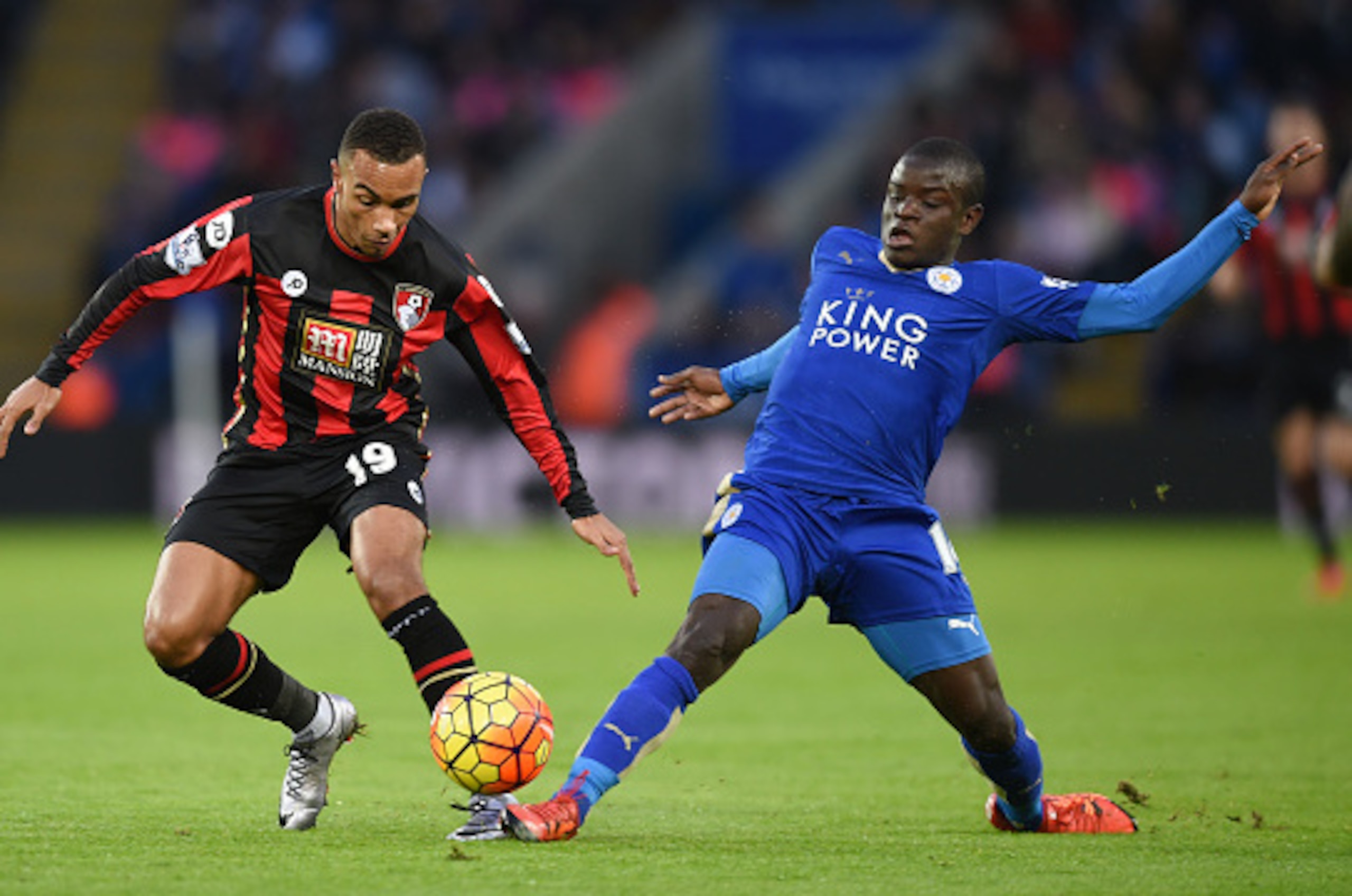 LEICESTER, ENGLAND - JANUARY 02: Junior Stanislas of Bournemouth and Ngolo Kante of Leicester City compete for the bacompete for the ballduring the Barclays Premier League match between Leicester City and Bournemouth at The King Power Stadium on January 2