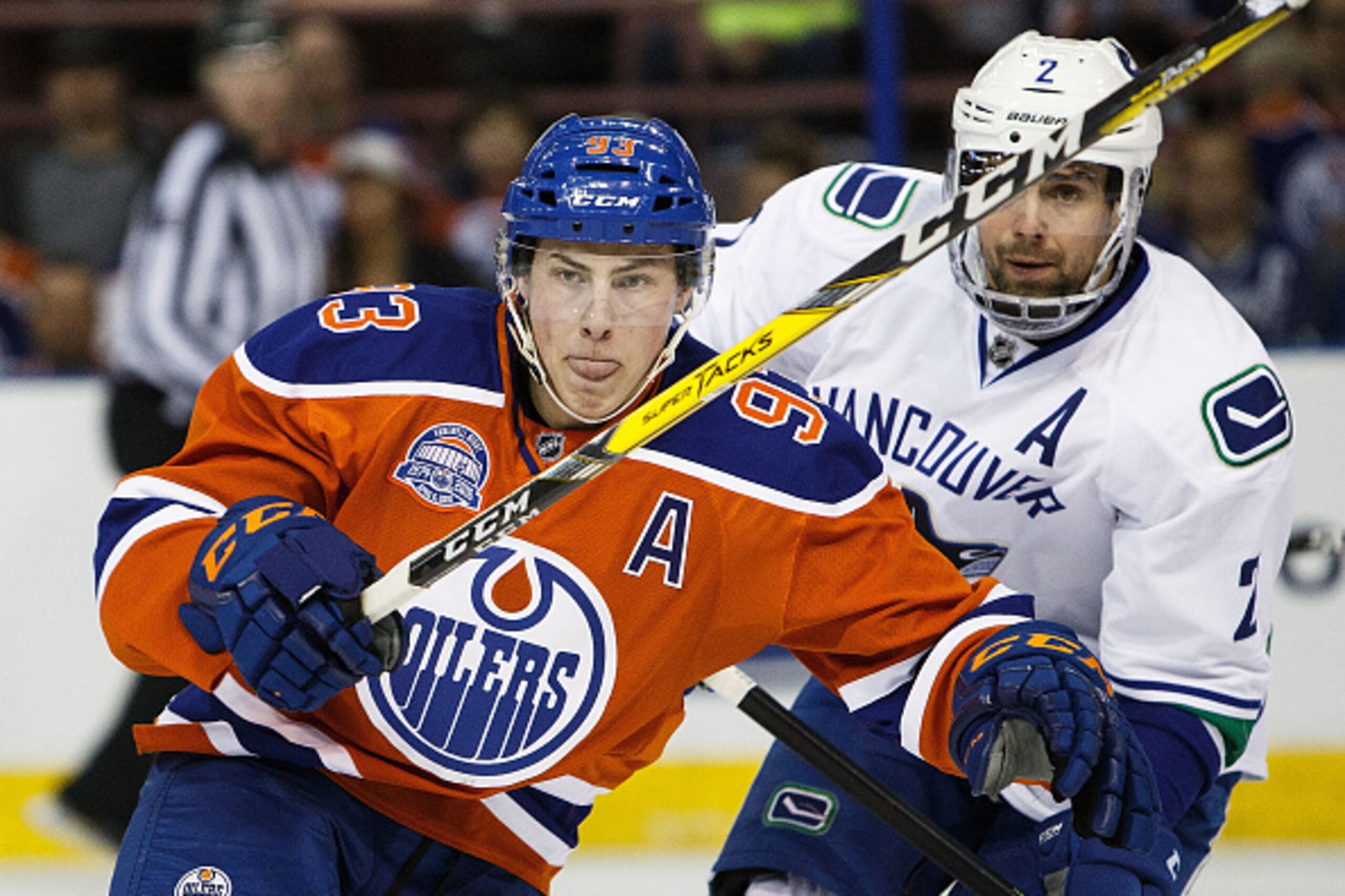 EDMONTON, AB - APRIL 6:  Ryan Nugent-Hopkins #93 of the Edmonton Oilers battles against Dan Hamhuis #2 of the Vancouver Canucks on April 6, 2016 at Rexall Place in Edmonton, Alberta, Canada. The game is the final game the Oilers will play at Rexall Place 