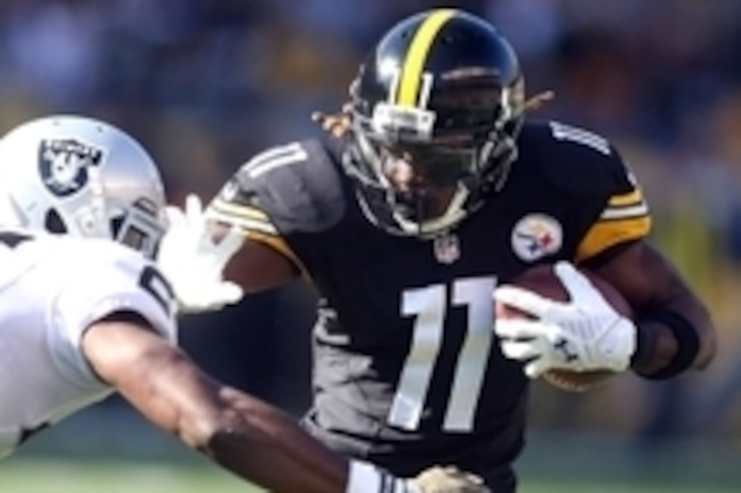 Nov 8, 2015; Pittsburgh, PA, USA; Pittsburgh Steelers wide receiver Markus Wheaton (11) runs after a catch as Oakland Raiders cornerback D.J. Hayden (25) defends during the first quarter at Heinz Field. Mandatory Credit: Charles LeClaire-USA TODAY Sports